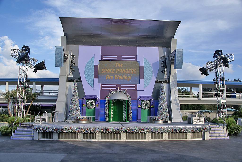 Stage decorated for A Totally Tomorrowland Christmas