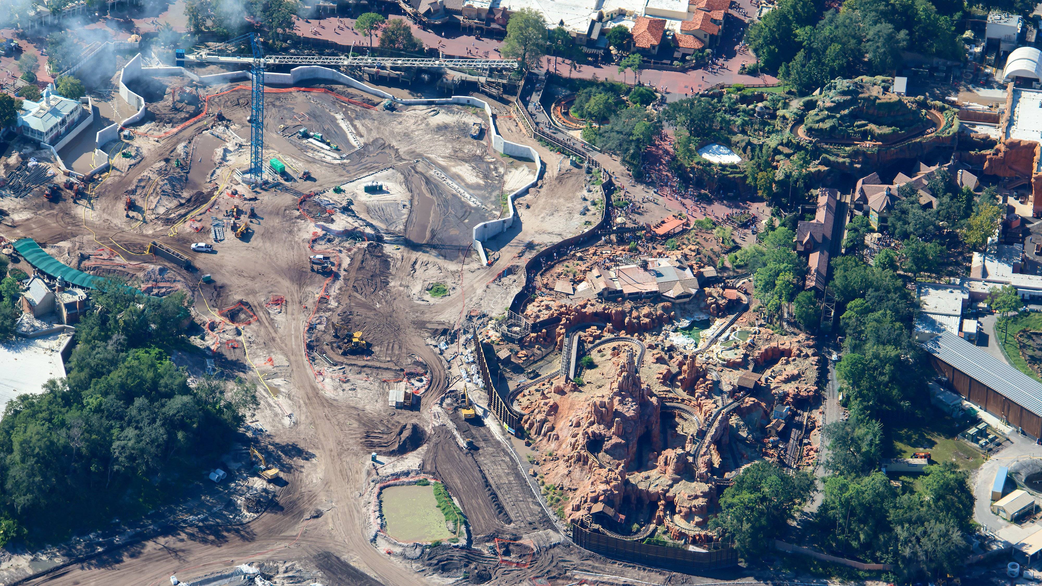 Tower crane and retaining-wall construction beside Big Thunder Mountain Railroad at Magic Kingdom
