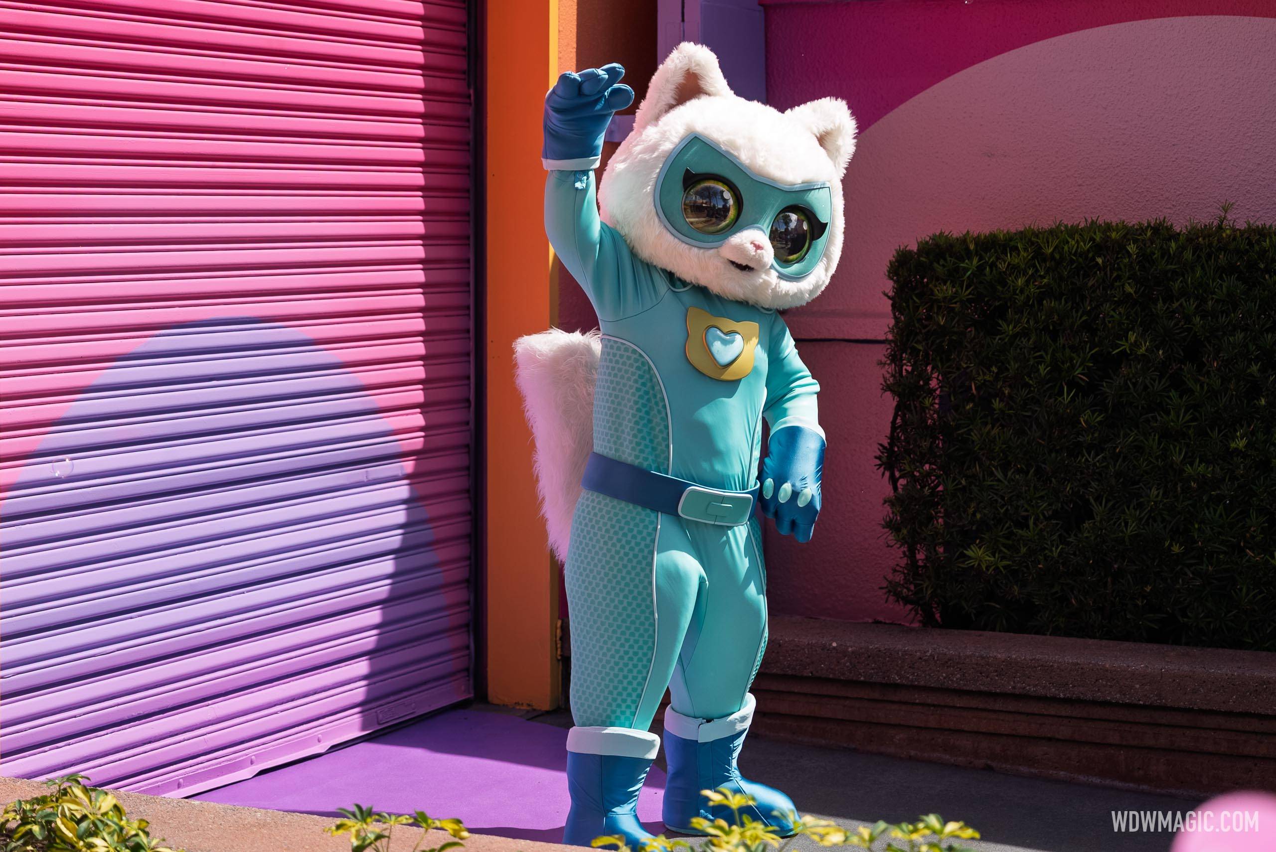 Bitsy waves to guests during the SuperKitties meet and greet on Commissary Lane at Disney's Hollywood Studios