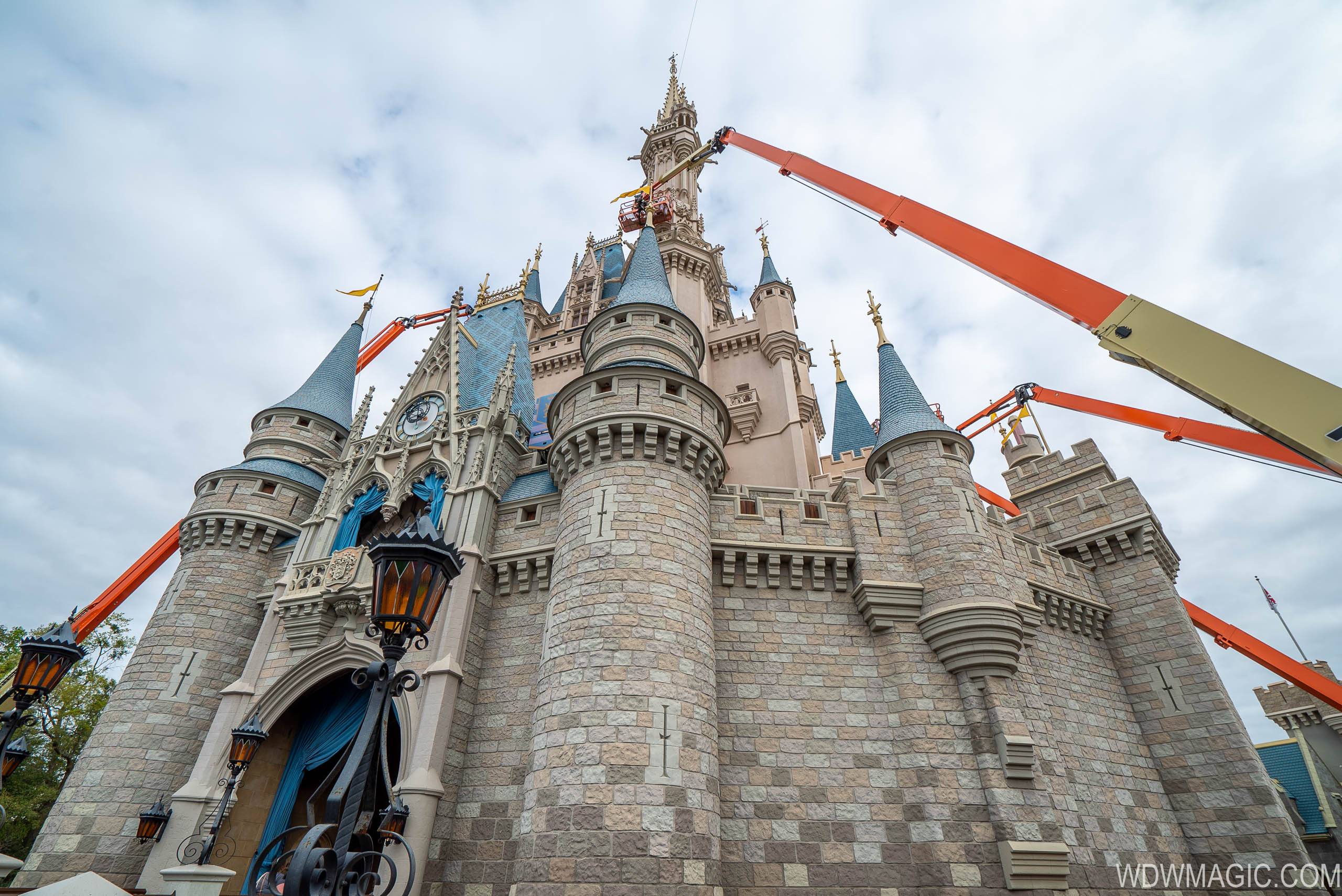 PHOTOS - High reach cranes up at Cinderella Castle as painting gets underway