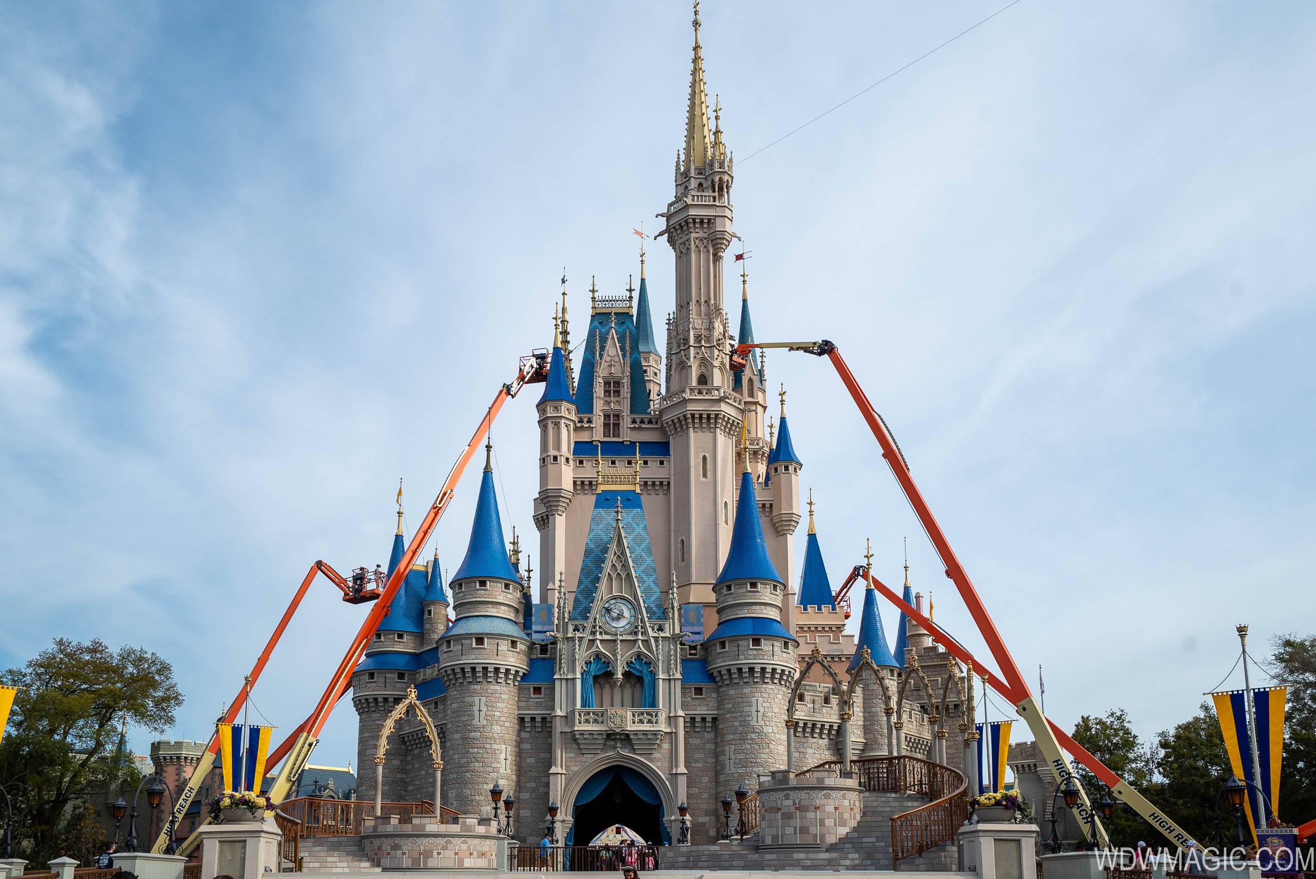 PHOTOS - Cinderella Castle's new paint scheme begins to take shape at the Magic Kingdom