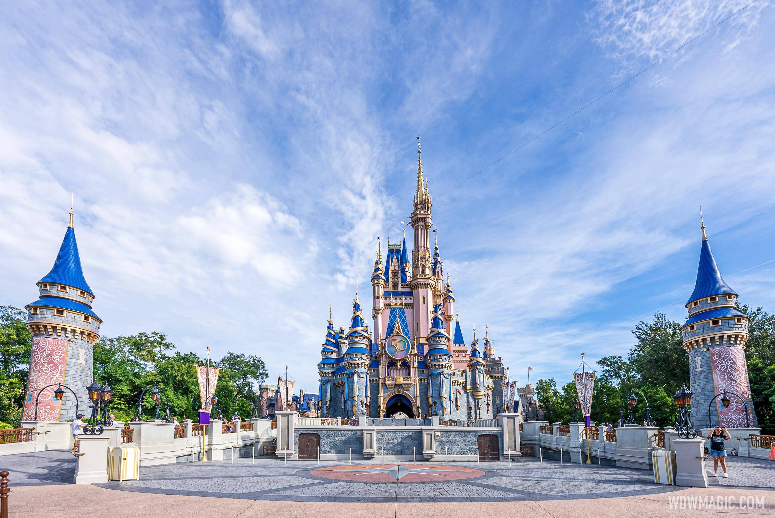 New 50th anniversary banners added to Cinderella Castle at Magic