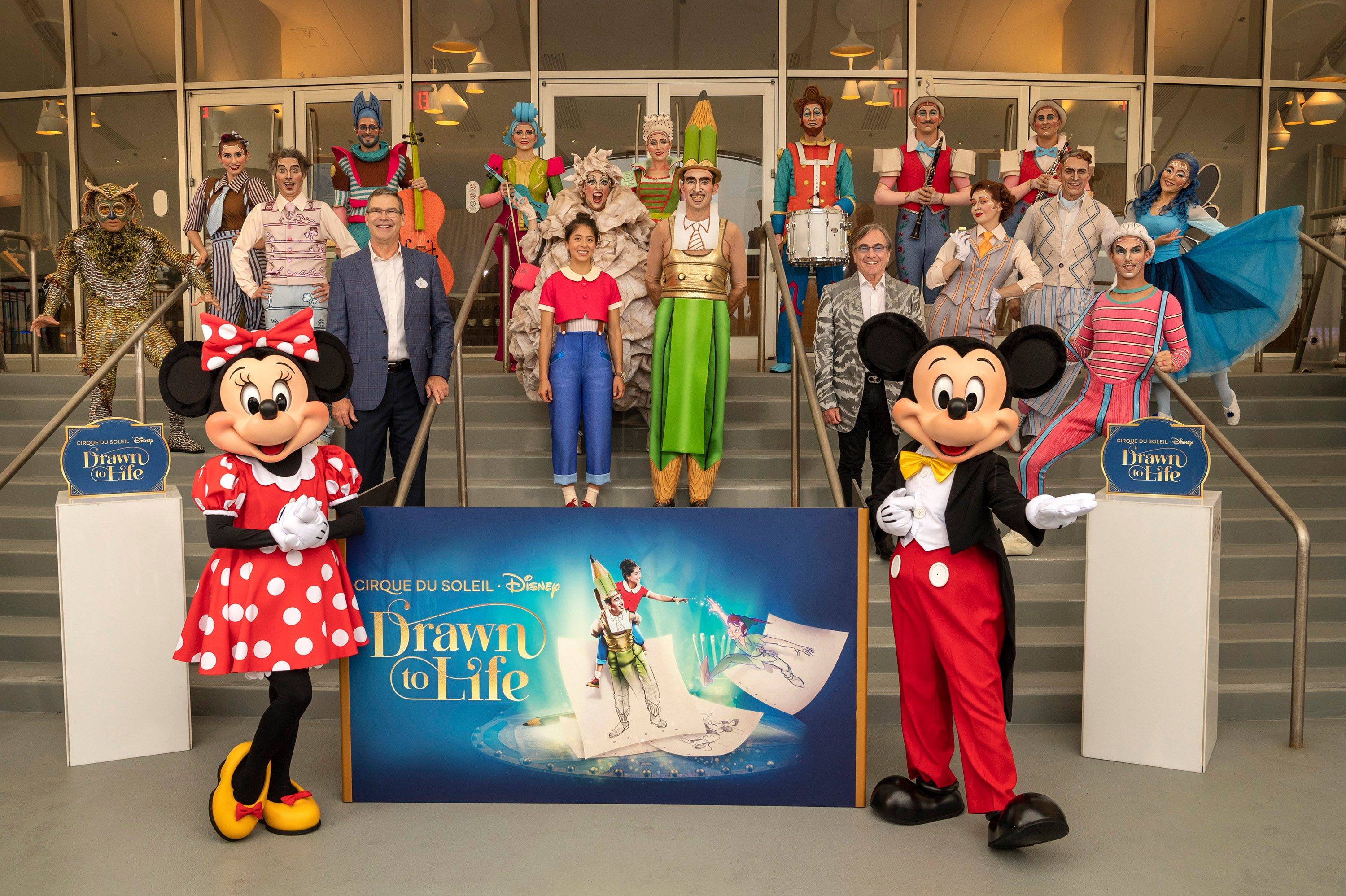 Front row from left to right: Minnie Mouse, Walt Disney World Resort President Jeff Vahle, the characters Julie and Mr. Pencil, Cirque du Soleil President and CEO Daniel Lamarre, and Mickey Mouse join artists from Drawn to Life, the highly anticipated new collaboration from Cirque du Soleil and Disney.