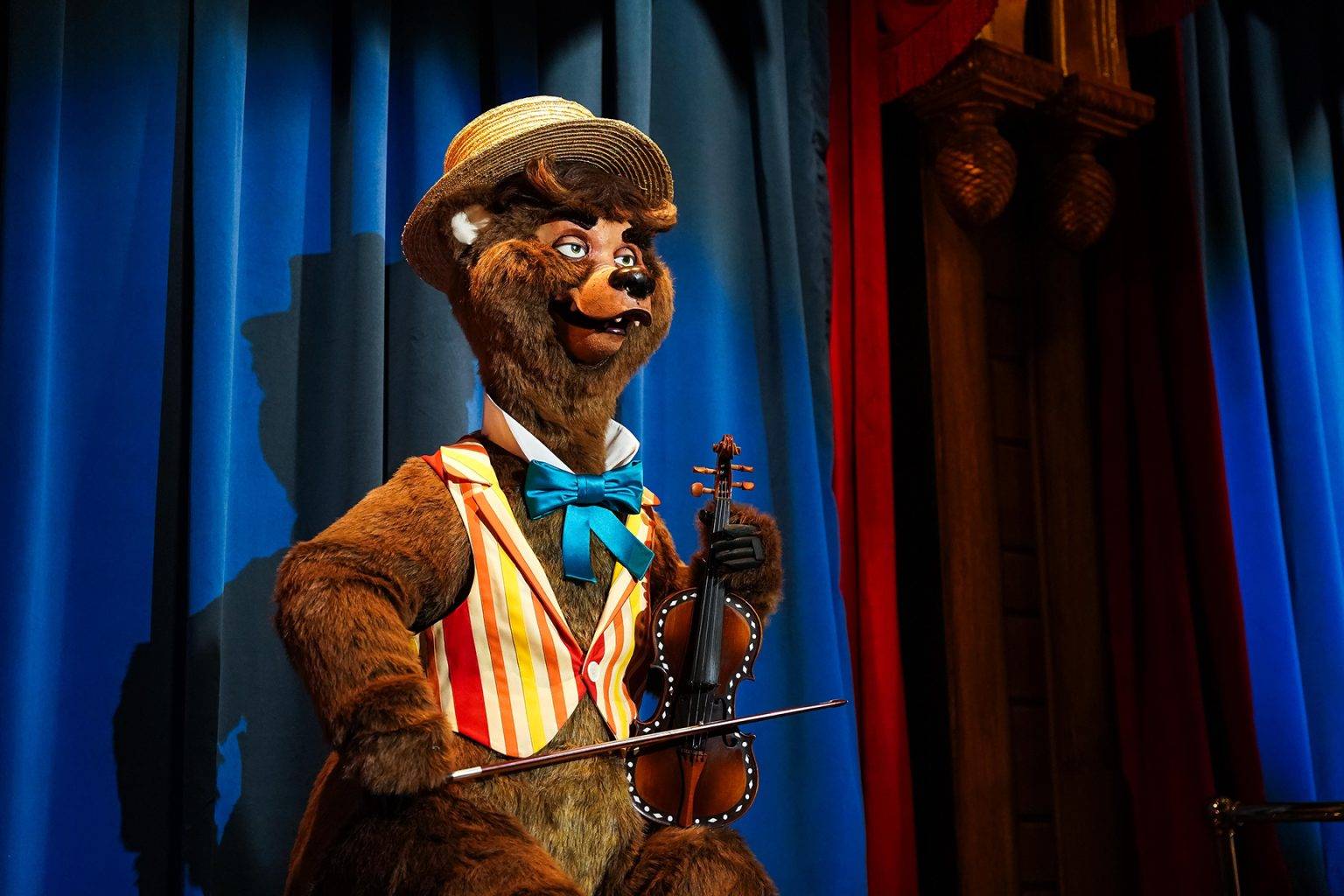 Ernest plays the fiddle at the Country Bear Musical Jamboree