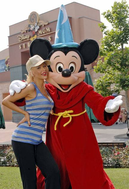 Christina Aguilera and Sorcerer Mickey Mouse at the Disney-MGM Studios.
