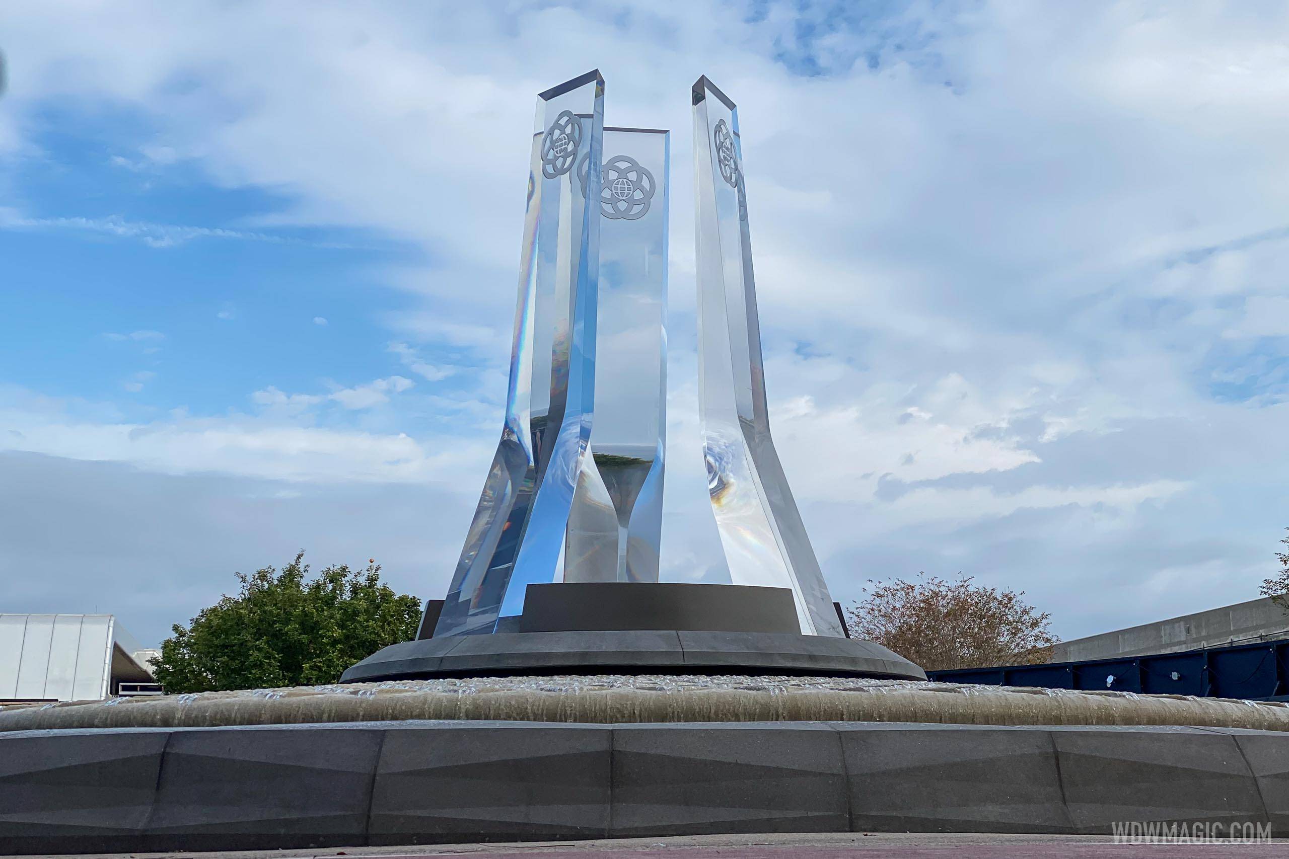 PHOTO - EPCOT's new main entrance fountain looks complete but remains behind construction walls