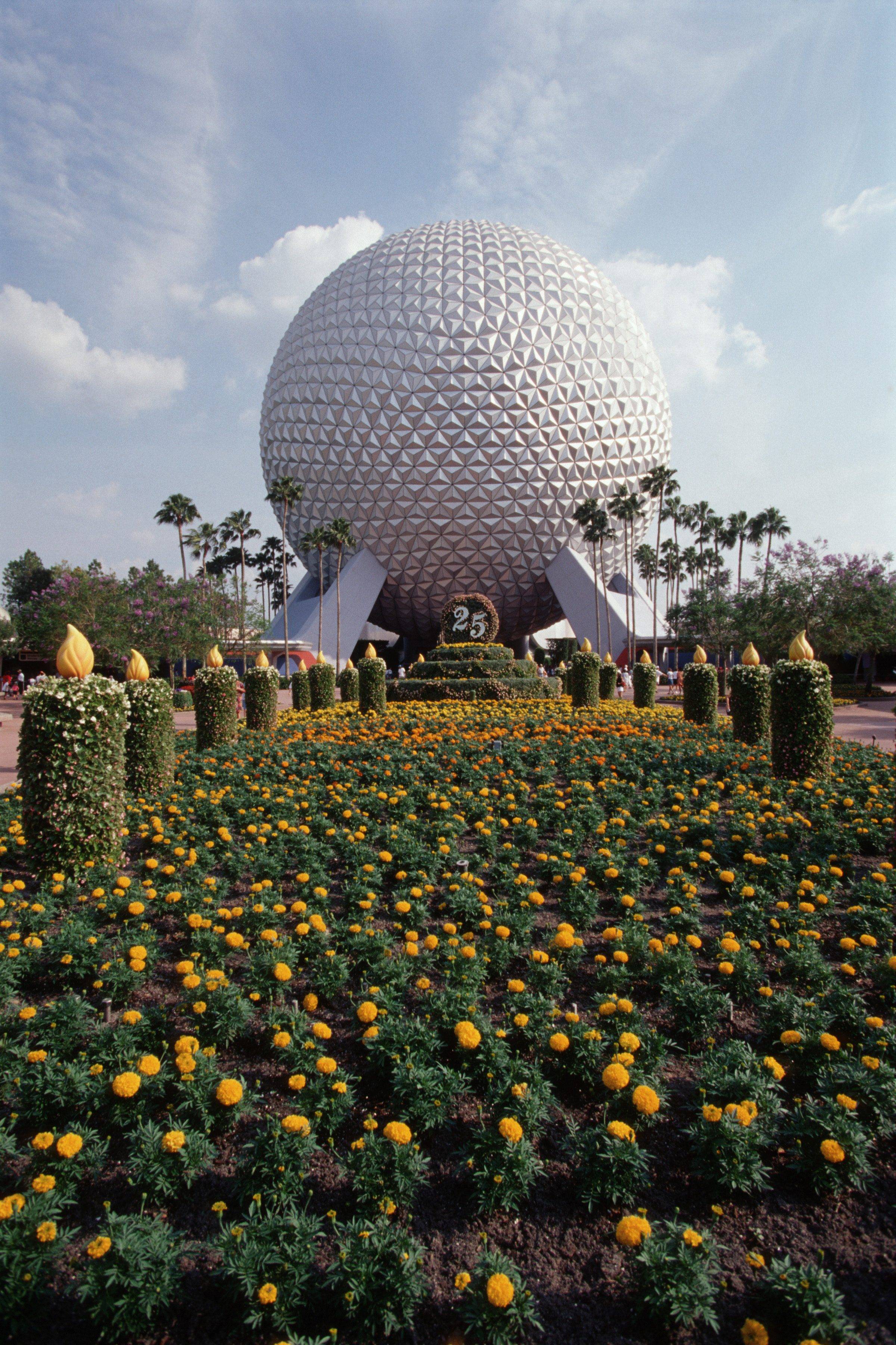 The entryway of EPCOT is decorated to celebrate the 25th Anniversary of Walt Disney World in 1997