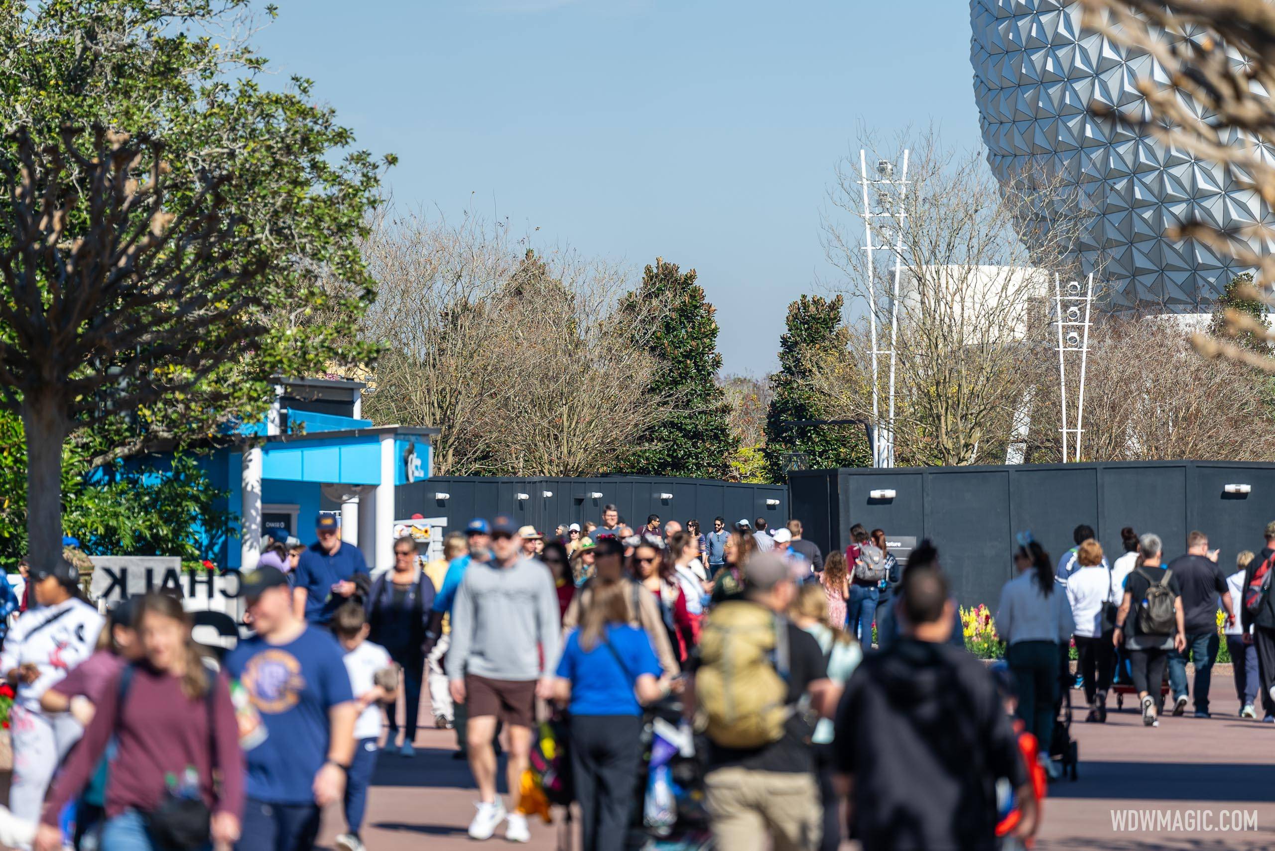 New construction walls block most of the World Celebration to World Showcase walkway at EPCOT