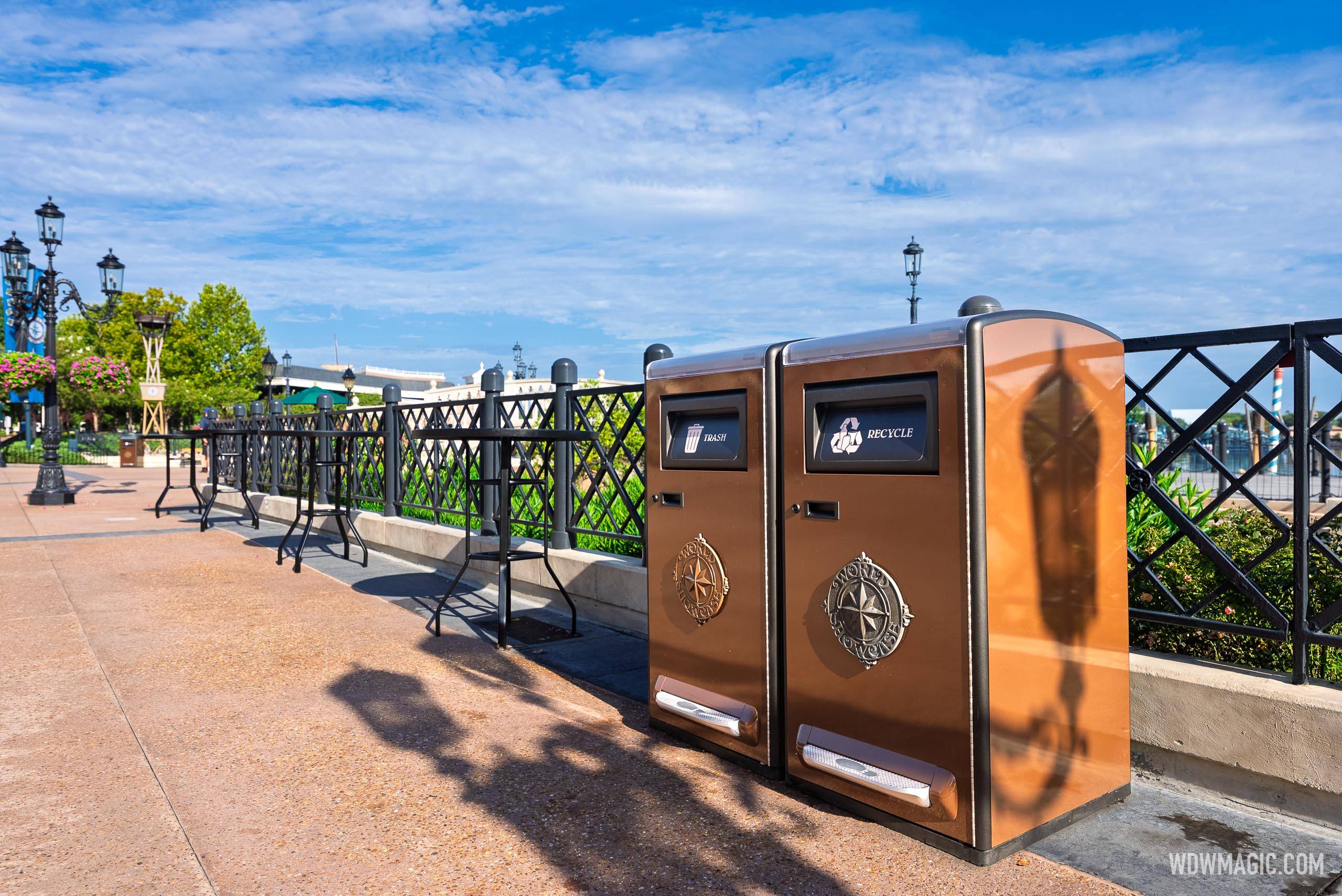 New World Showcase-medallion Bigbelly Smart Max trash and recycling bins along the waterfront promenade at EPCOT's World Showcase
