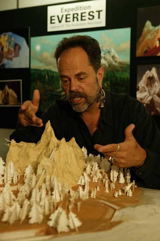 Joe Rohde with a model of Expedition Everest