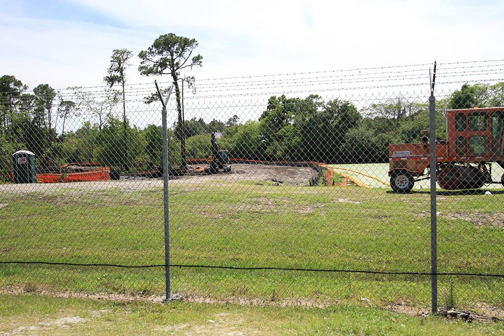 Construction staging area and access road behind the Magic Kingdom