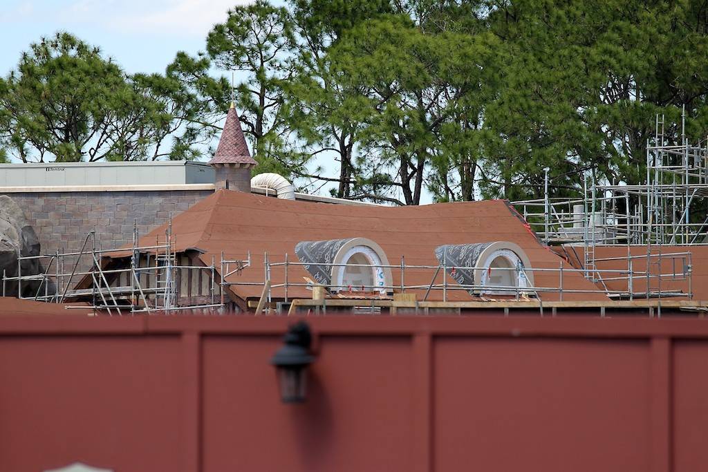 PHOTOS - Mine Train coaster rises above the construction walls in the new Fantasyland