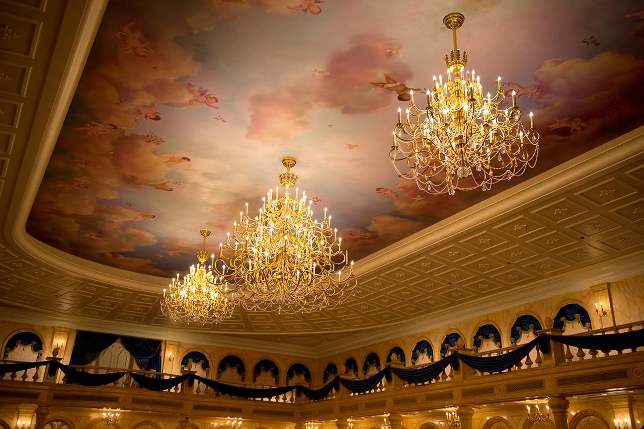 Fairytale Elegance at Be Our Guest Restaurant – Decorated with a coffered, 20-foot ceiling with fluffy clouds and cherubs, the ballroom at Be Our Guest Restaurant features sparkling chandeliers designed to convey the elegance of the Beast’s Castle in “Beauty and the Beast.”