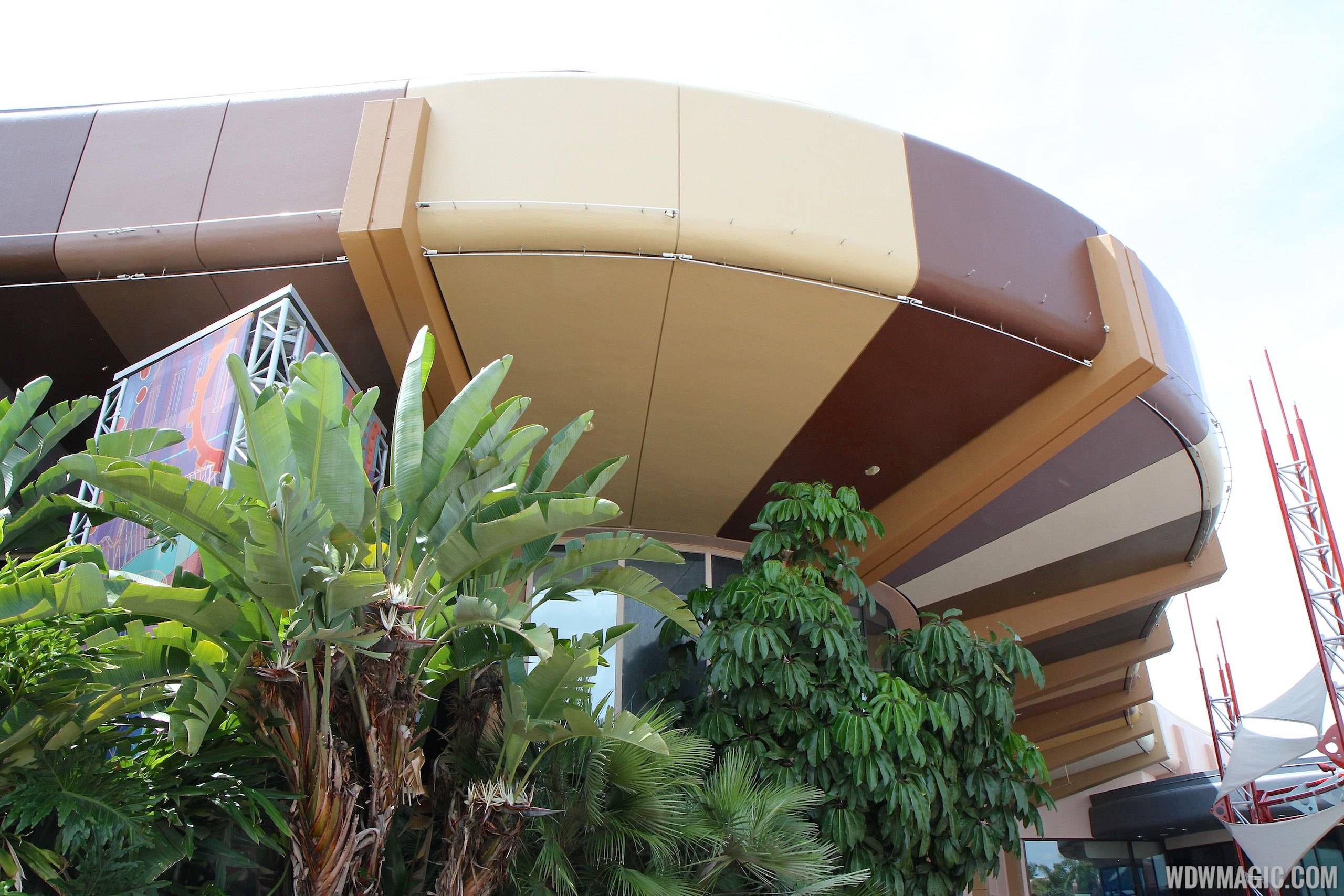PHOTOS - New paint scheme for the Communicore buildings at Epcot nears half-way complete