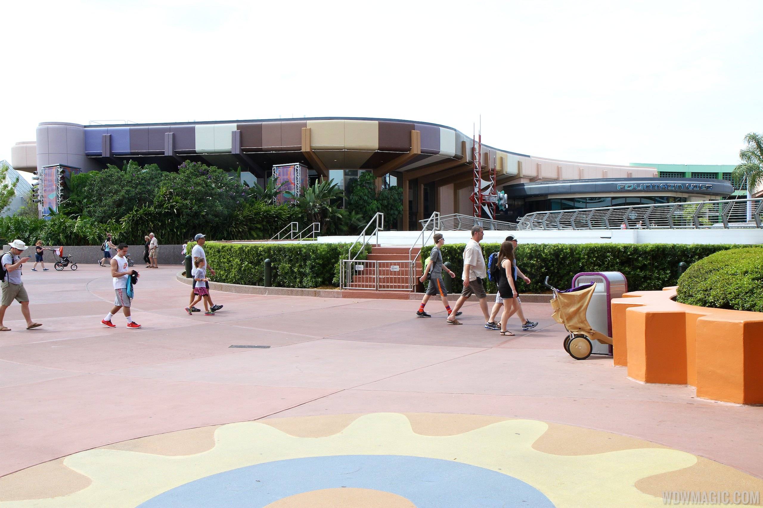 PHOTOS - New paint scheme for the Communicore buildings at Epcot nears half-way complete