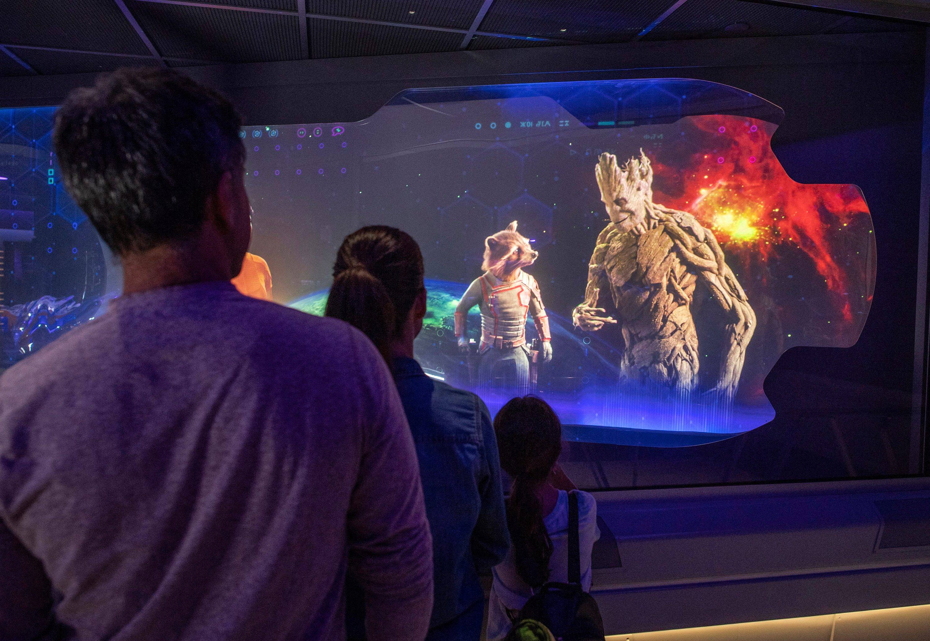 Legendary outlaws Rocket (left) and Groot (right) appear in Guardians of the Galaxy: Cosmic Rewind queue