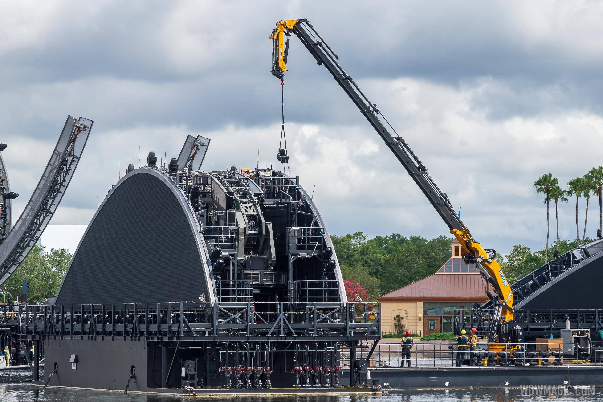 Hardware being removed from the Harmonious show platform barges at EPCOT