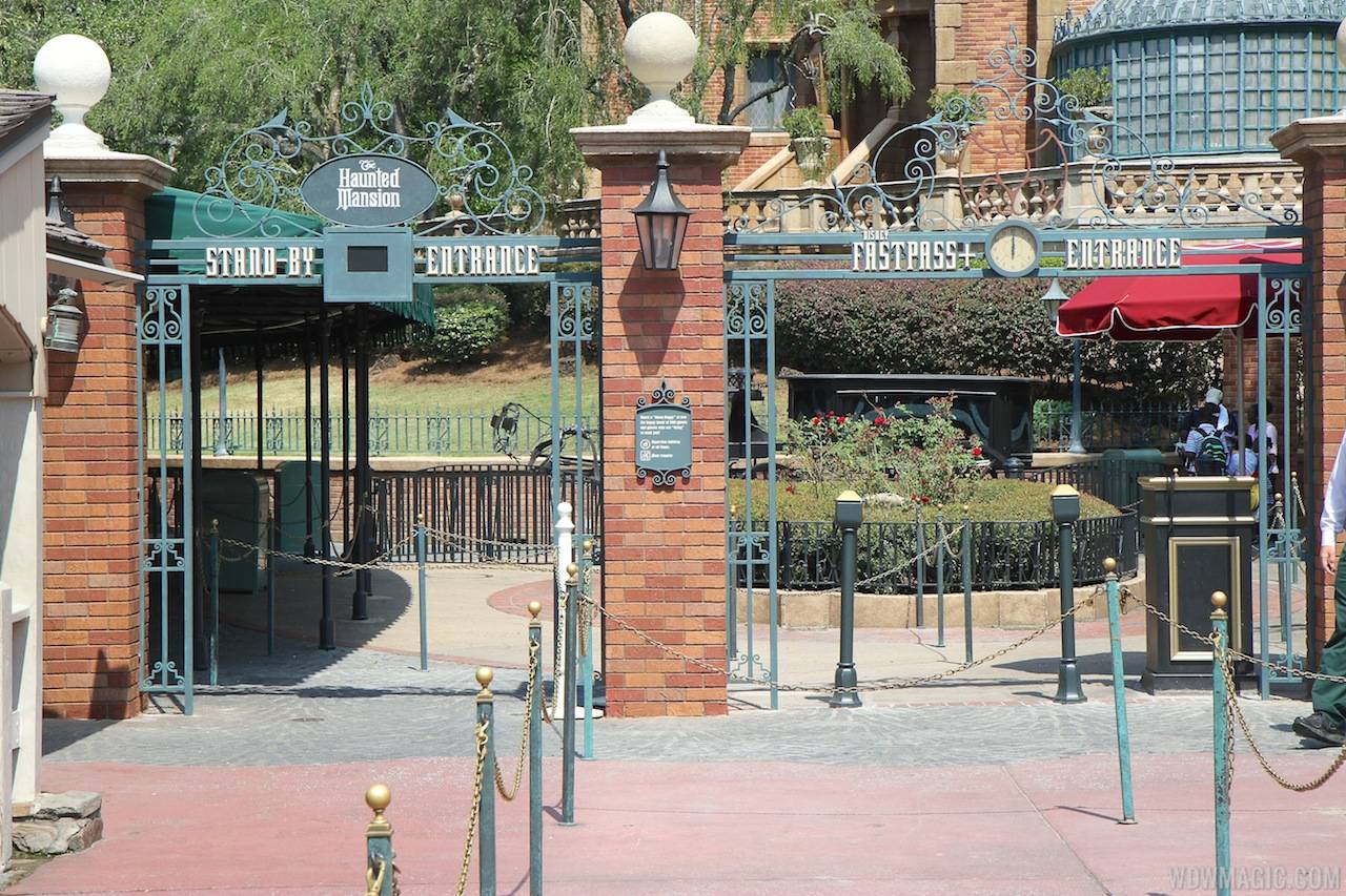 New Haunted Mansion entrance signage for FastPass and Standby