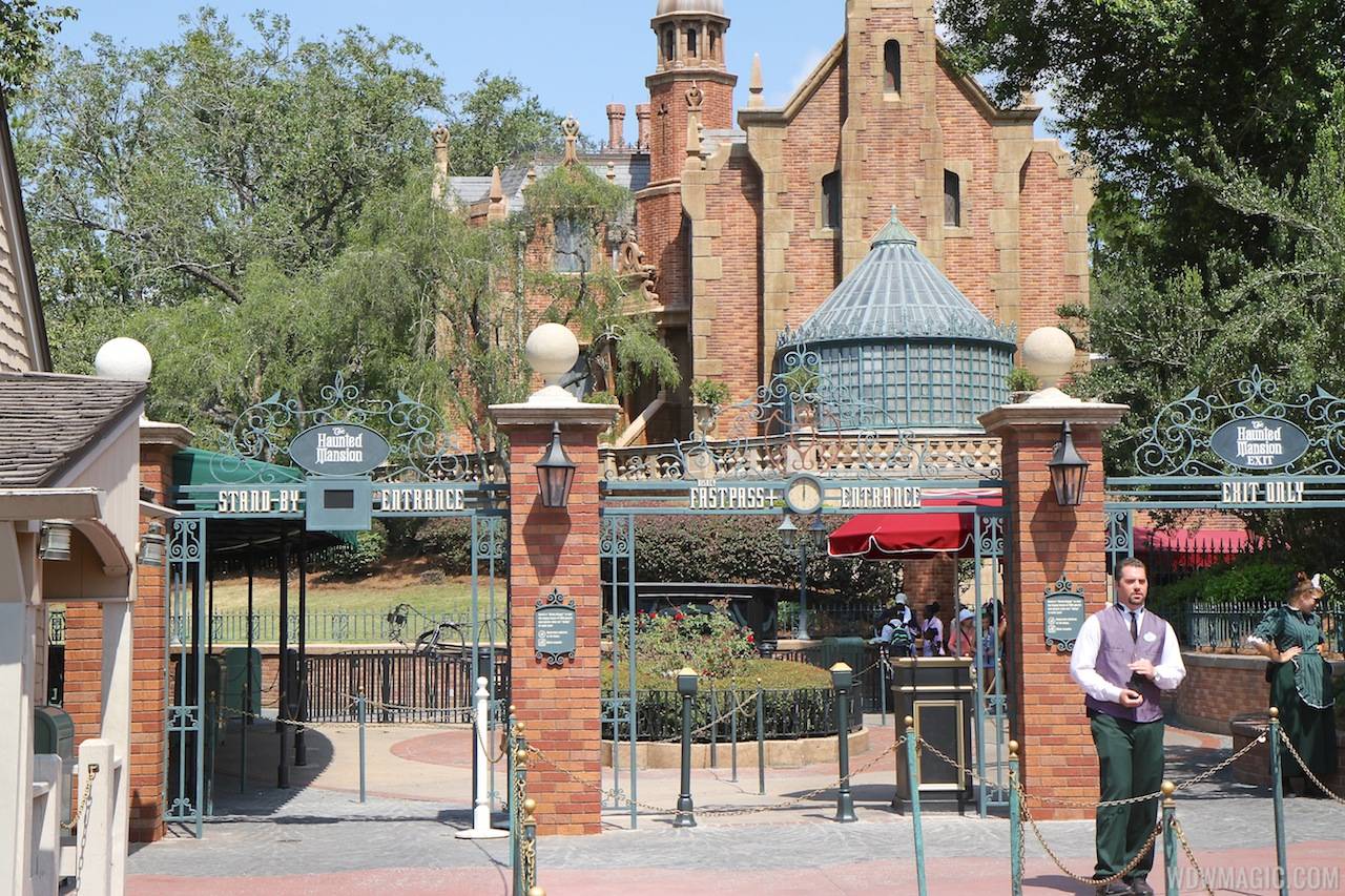 New Haunted Mansion entrance signage for FastPass and Standby