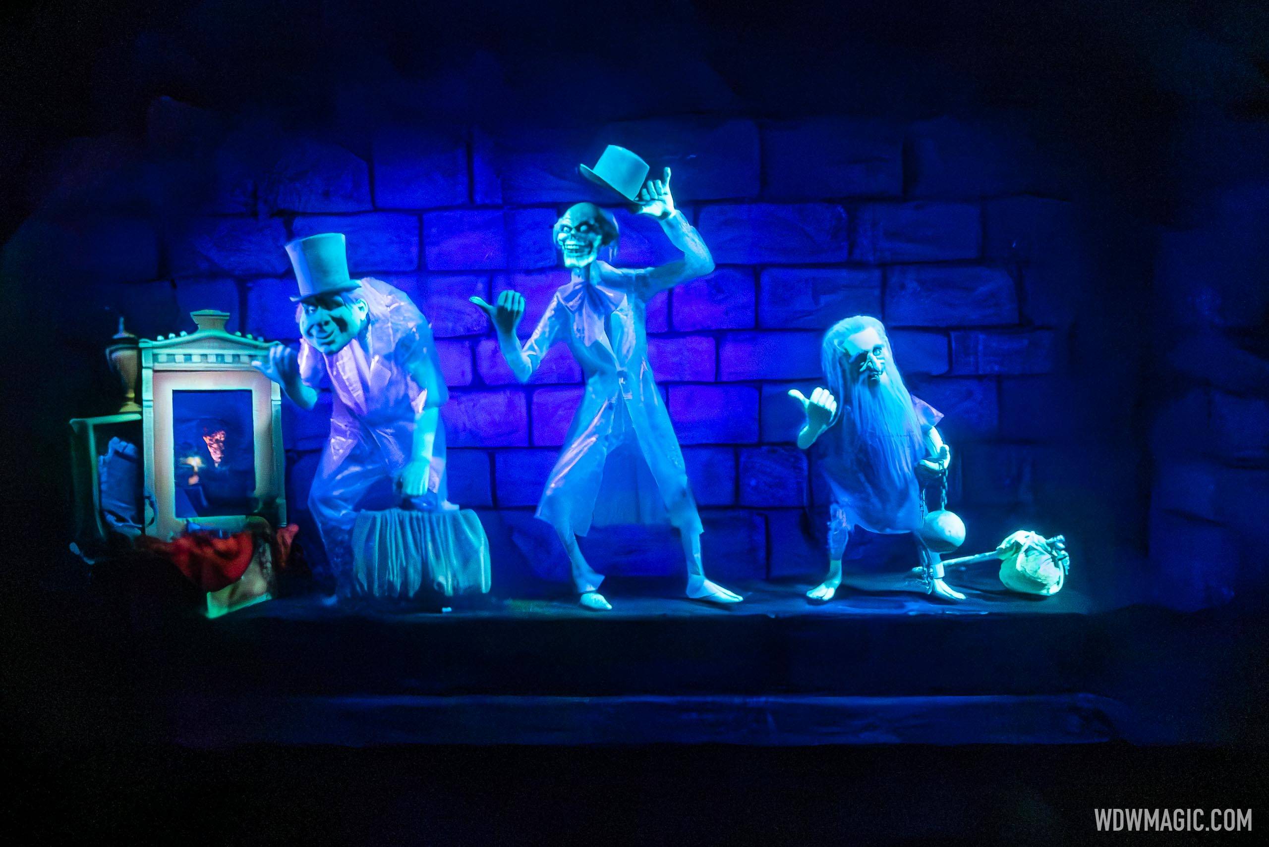 Animated figures return to the the Hitchhiking Ghost scene at the Haunted Mansion