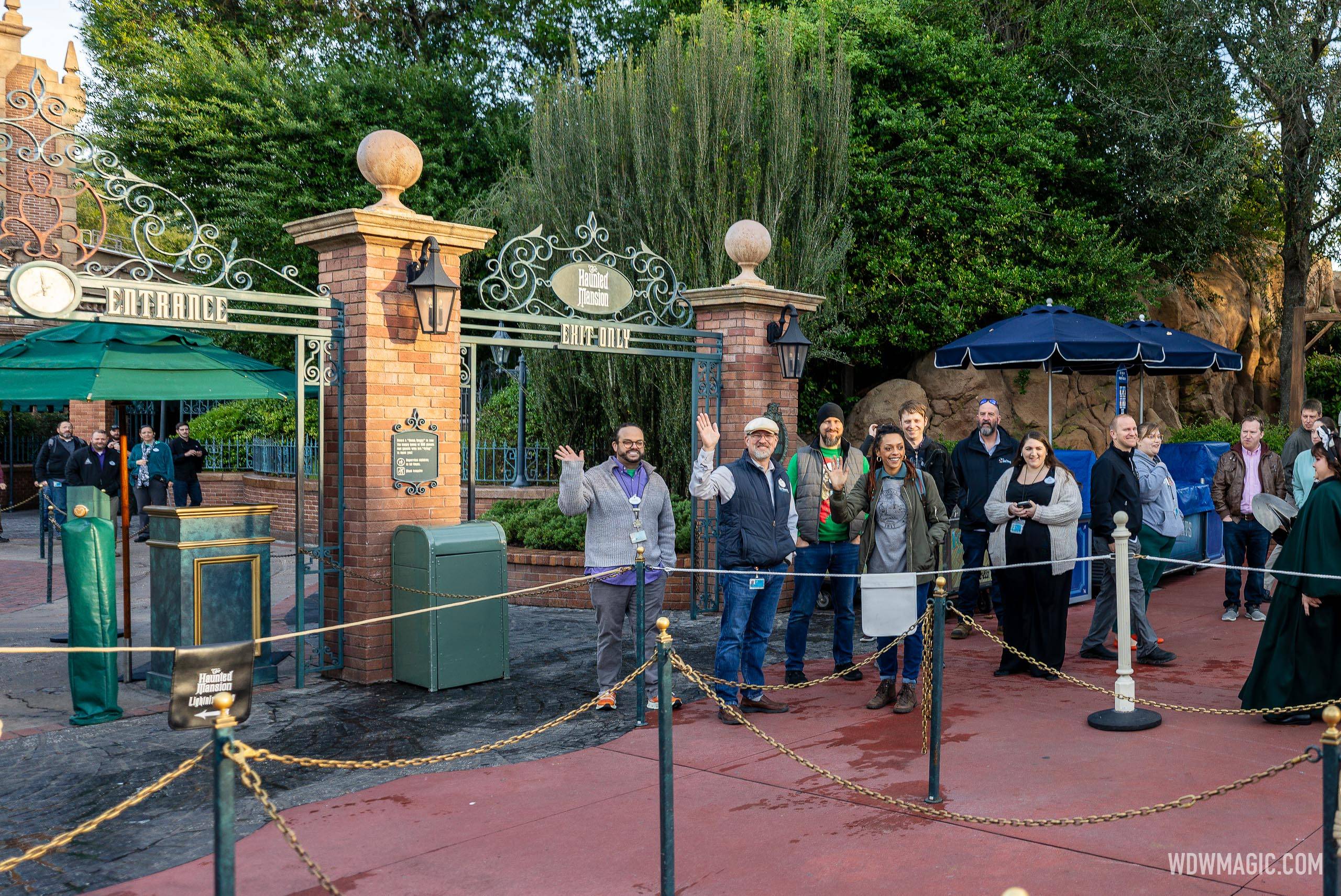 Imagineers greeting guests arriving to see the Hatbox Ghost on his debut at Magic Kingdom