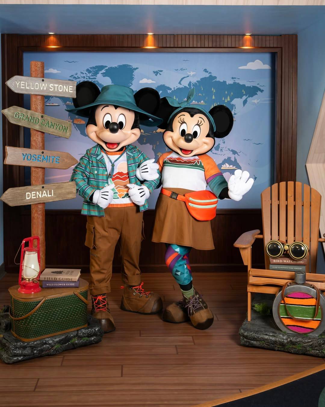 Mickey Mouse and Minnie Mouse pose in national parks-inspired outfits at the DVC ImaginAtrium at EPCOT,