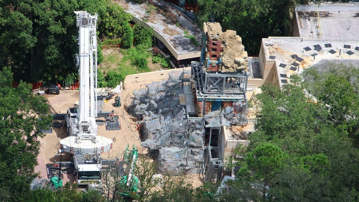 Aerial view of the Indiana Jones and the Myth of the Jade Serpent construction site, with a large crane positioned alongside the partially assembled temple facade