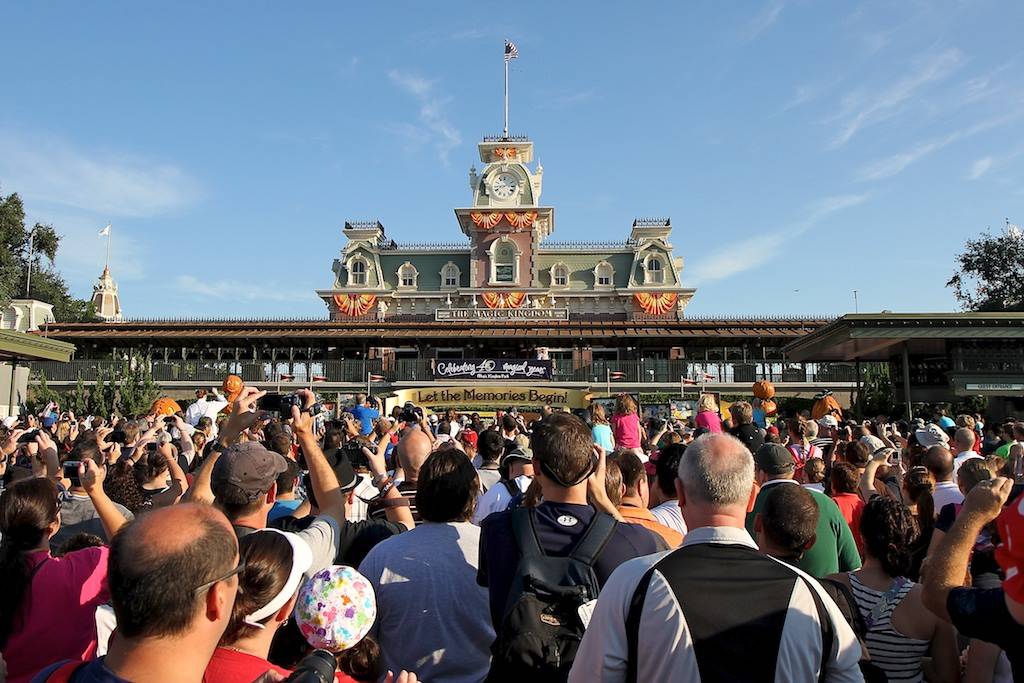 Crowds gather at the entrance to the Magic Kingdom to see the welcome show