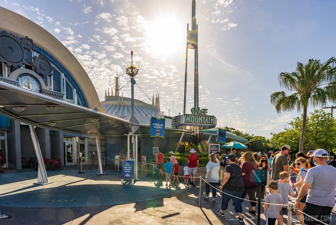 Some guests in the overflow queue at Space Mountain are not wearing masks in accordance with new rules