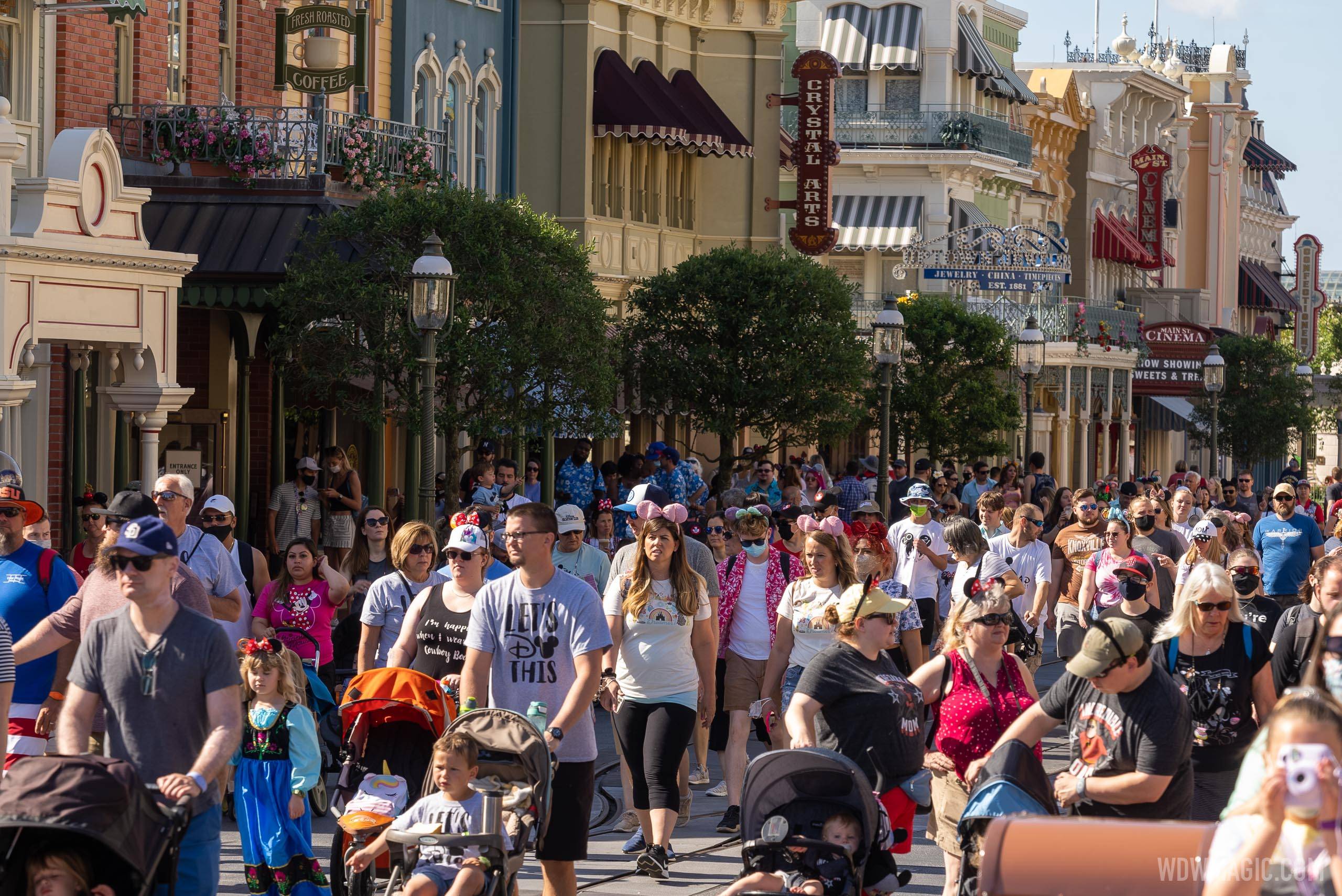 Guests walking along Main Street U.S.A. with the optional masks rules in place on May 15