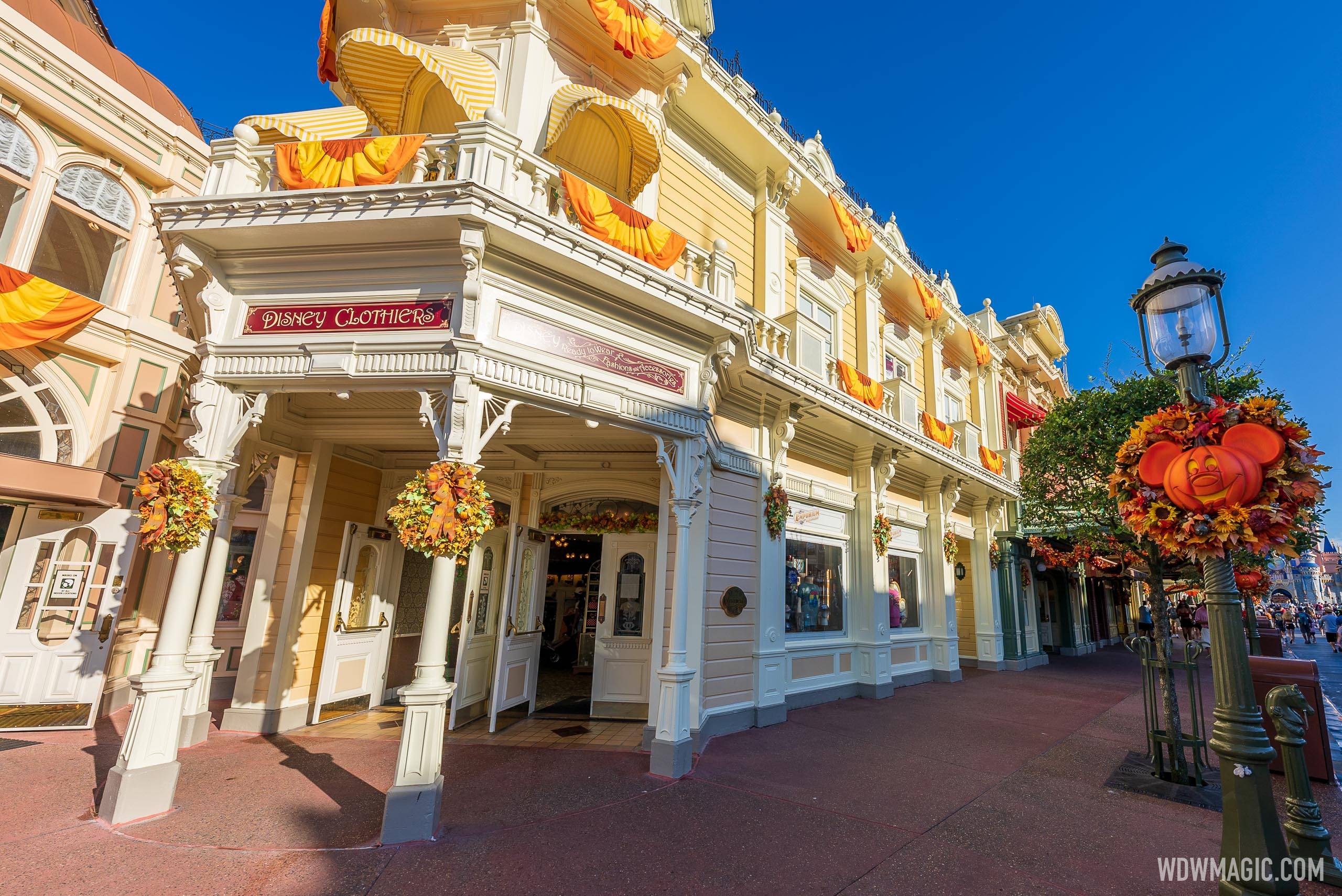 Academy of Talent Education and Training' window on Main Street U.S.A. above Disney Clothiers