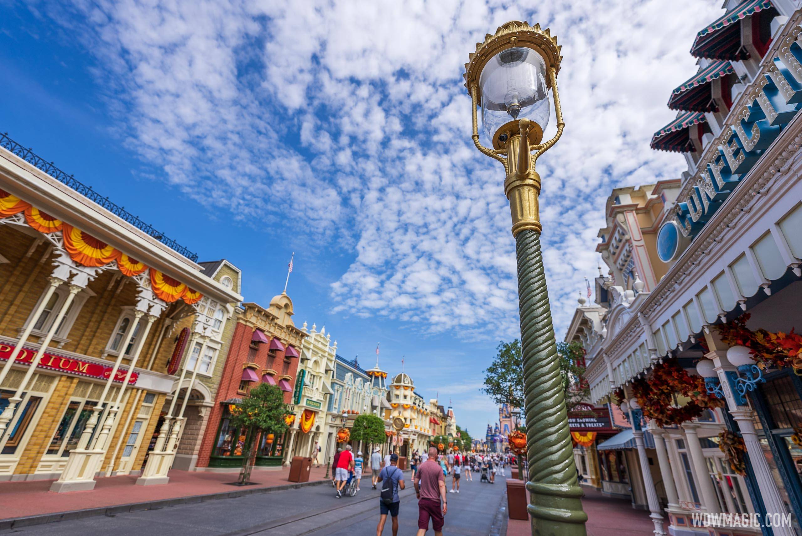 Lamp posts turn to gold on Main Street U.S.A. as the 50th anniversary decor continues to be installed