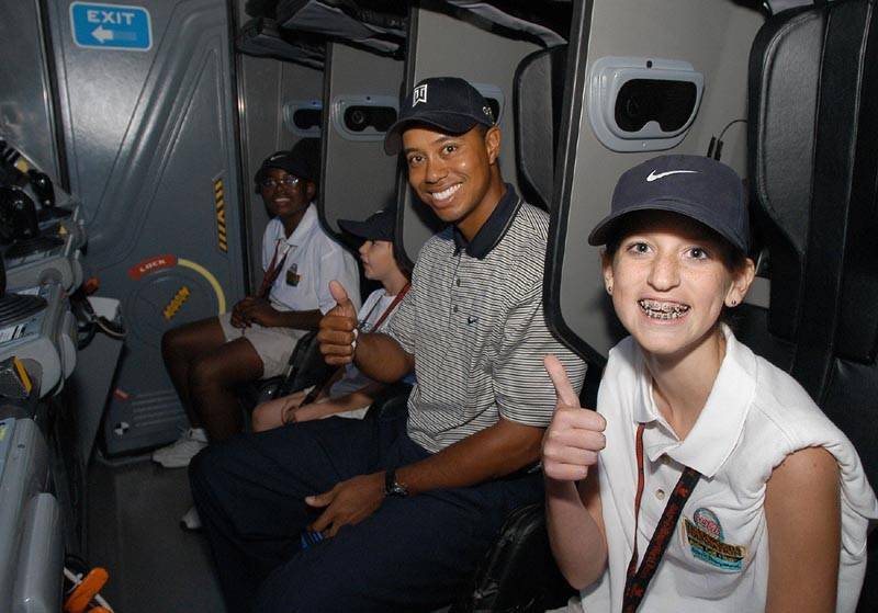 Tiger Woods riding Mission SPACE.