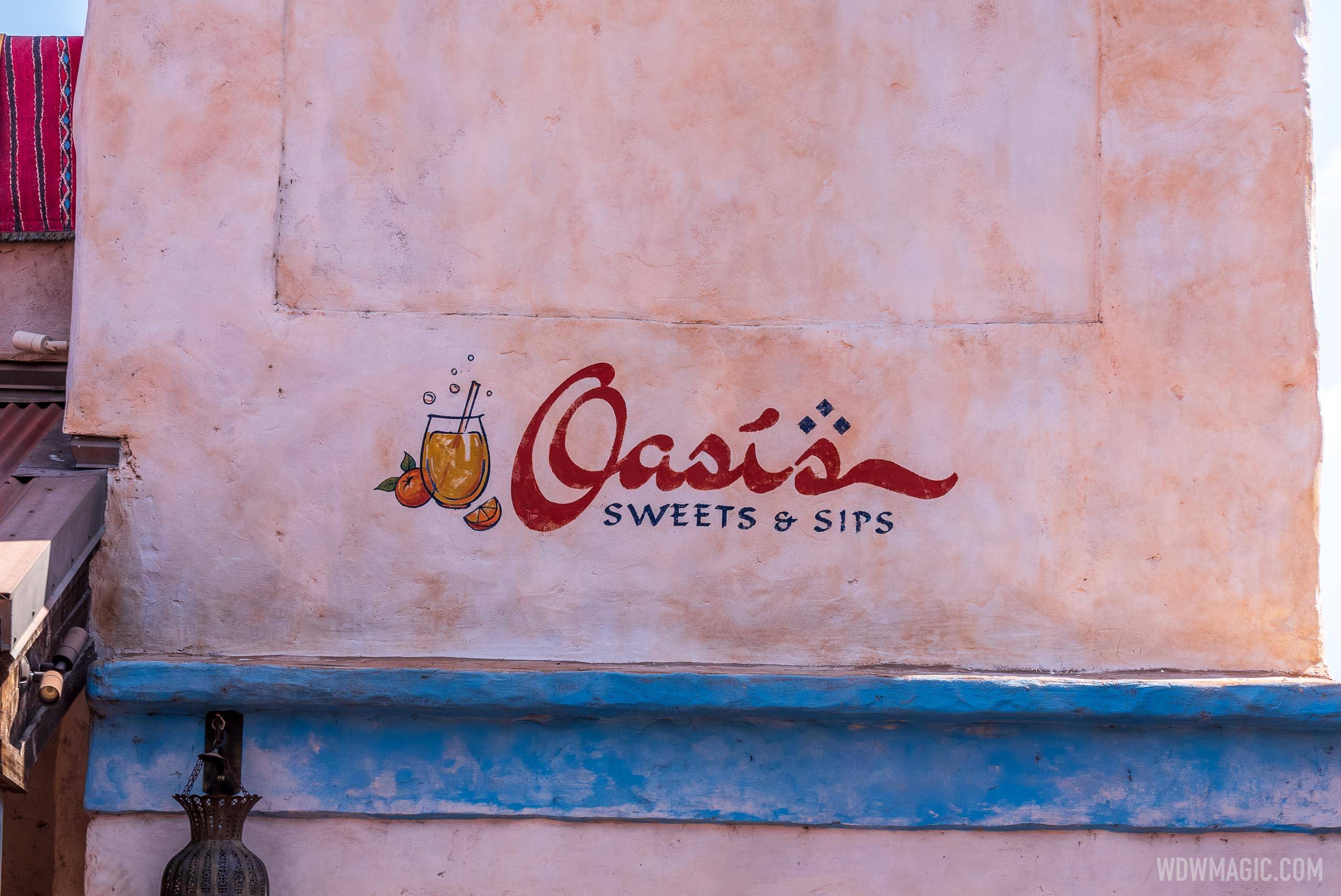 Oasis Sweets and Sips signage