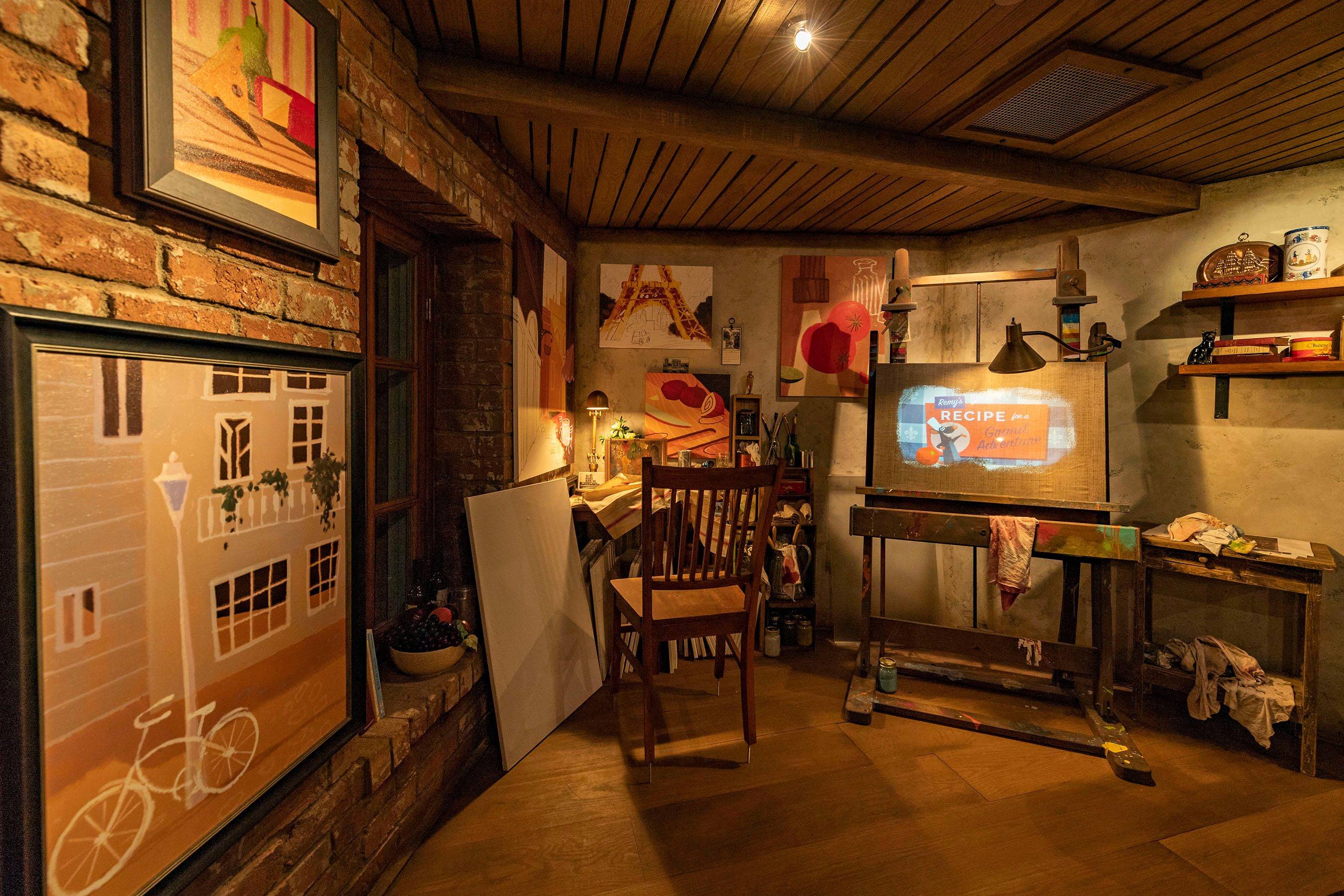 Guests enter a French artist’s loft featuring French-inspired paintings, cupboards filled with art supplies and two magical canvases that come to life in the queue for Remy’s Ratatouille Adventure