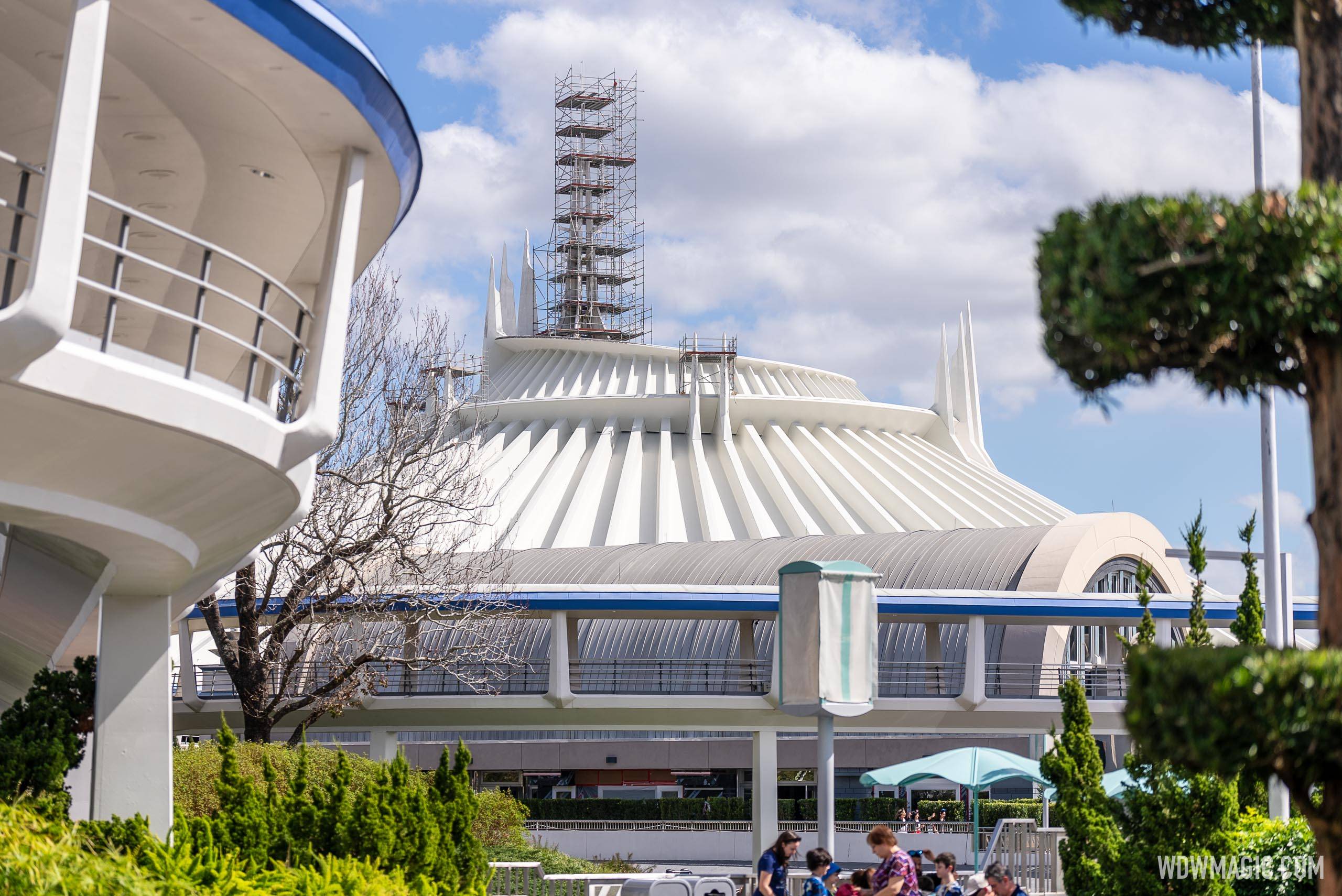 Spires of Space Mountain behind scaffolding as exterior refurbishment continues at Walt Disney World