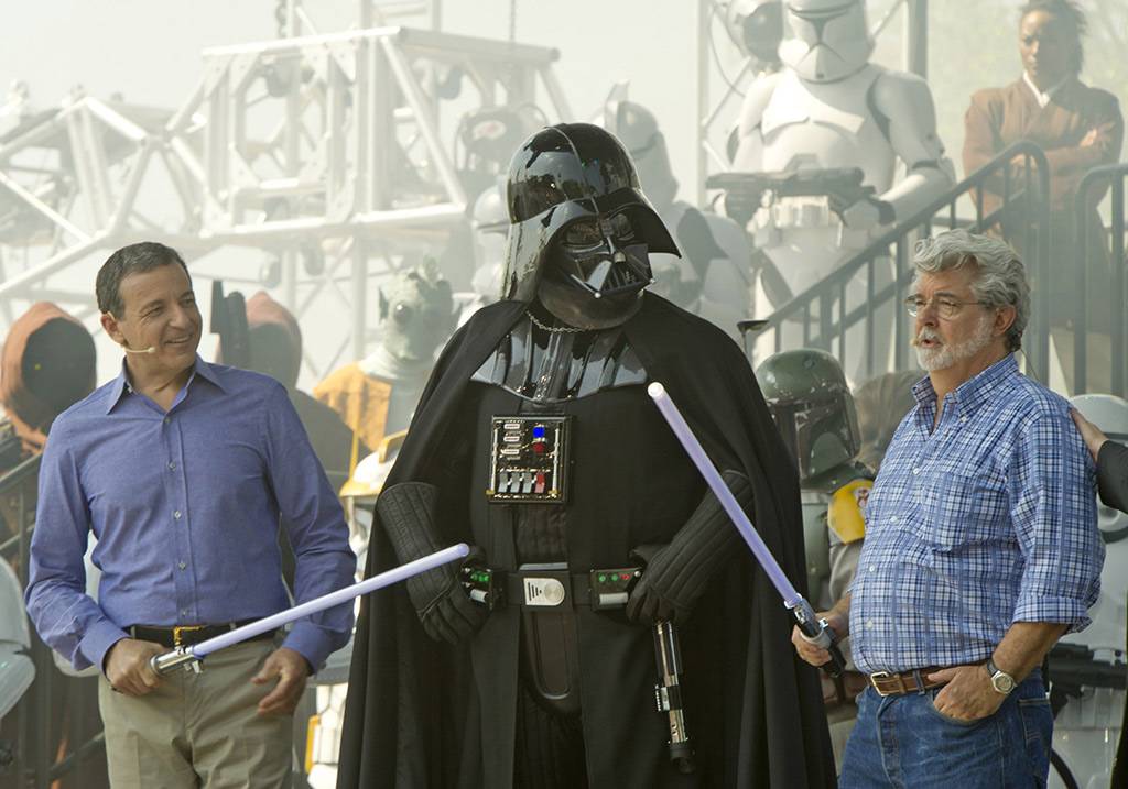 Walt Disney Co. president and CEO Bob Iger (left) and "Star Wars" creator George Lucas (right) join "Star Wars" villain Darth Vader (center) May 20, 2011 at Disney's Hollywood Studios 