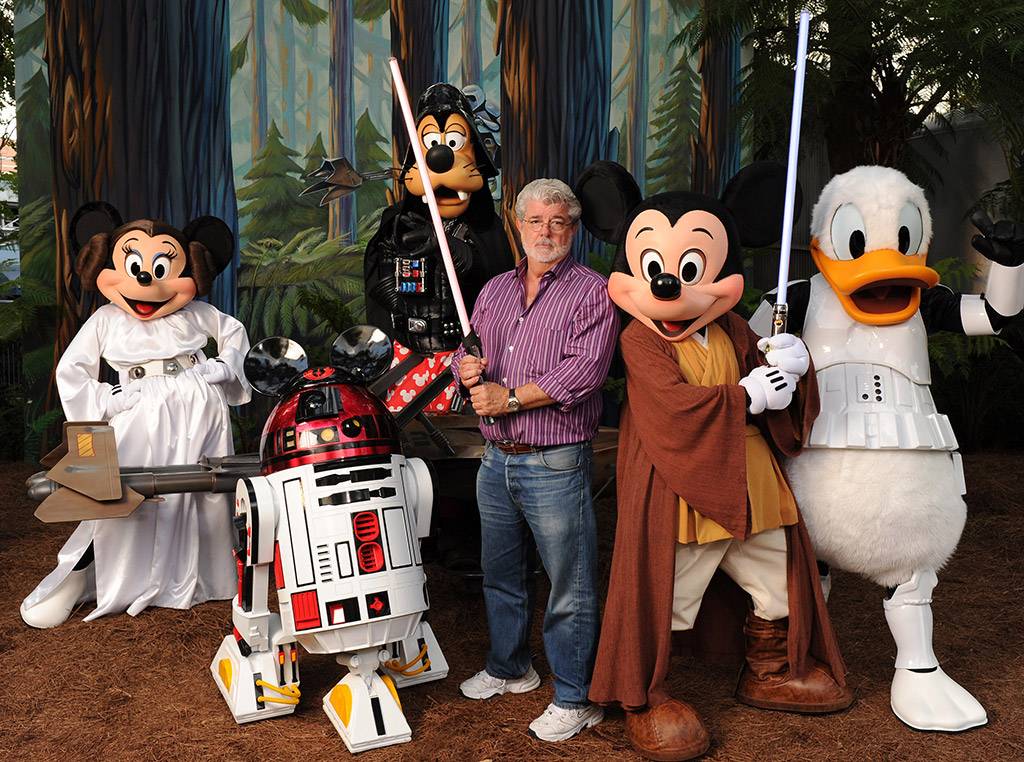 A SHOW OF 'FORCE': Taking on the determined look of a Jedi Knight, "Star Wars" creator George Lucas poses Aug. 14, 2010 with Jedi Mickey Mouse, Princess Leia Minnie, Darth Goofy -- and the loveable Disney droid, R2-MK -- at Disney's Hollywood Studios theme park. The legendary filmmaker attended "The Last Tour to Endor," a special event at the theme park in honor of the "Star Wars"-themed thrill attraction, Star Tours. 