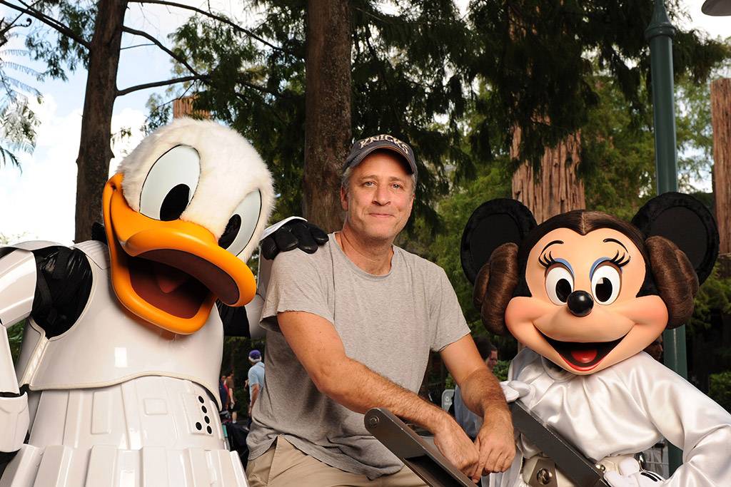 THE DAILY MAGIC: "The Daily Show" host Jon Stewart poses Aug. 14, 2010 at Disney's Hollywood Studios with "Star Wars"-inspired Disney characters Stormtrooper Donald Duck and Princess Leia Minnie Mouse. Stewart was in Orlando as a special host of "Star Wars Celebration V," the official Lucasfilm fan event held at the Orange County Convention Center. 