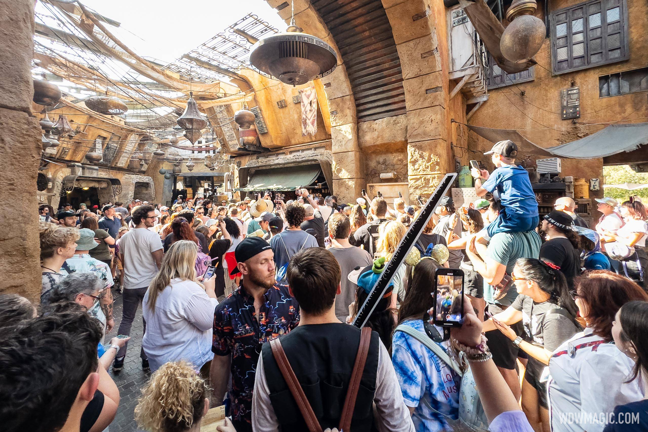 Chaotic scenes in Star Wars Galaxy's Edge at Walt Disney World as guests scramble to see the Mandalorian and Grogu