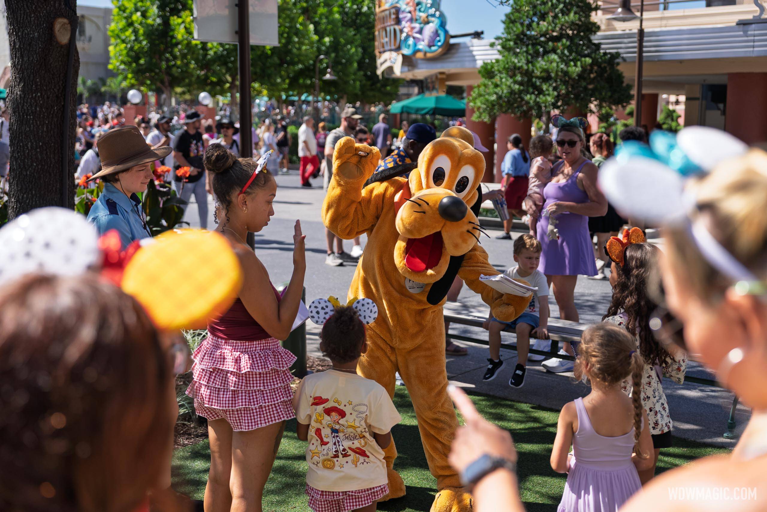 Pluto greets guests in the Walt Disney Studios courtyard outside the Magic of Disney Animation
