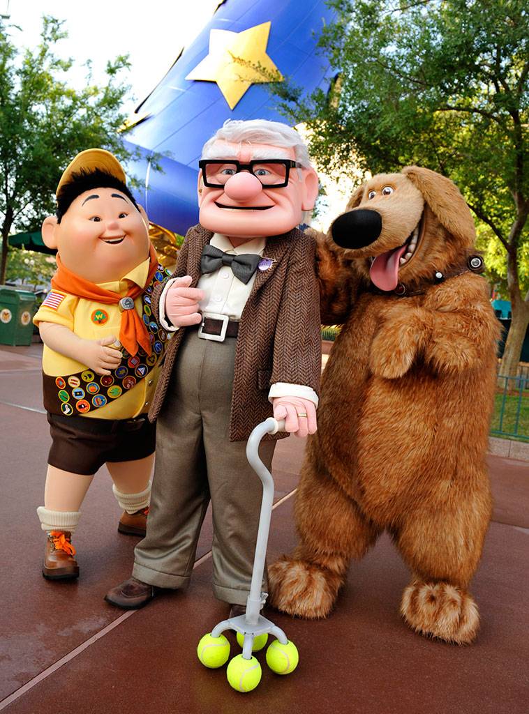 UP Meet and Greet characters - Russell, an eight-year-old Wilderness Explorer, Carl Fredricksen, a 78-year-old balloon salesman and Dug, a dog. Copyright 2009 The Walt Disney Company.