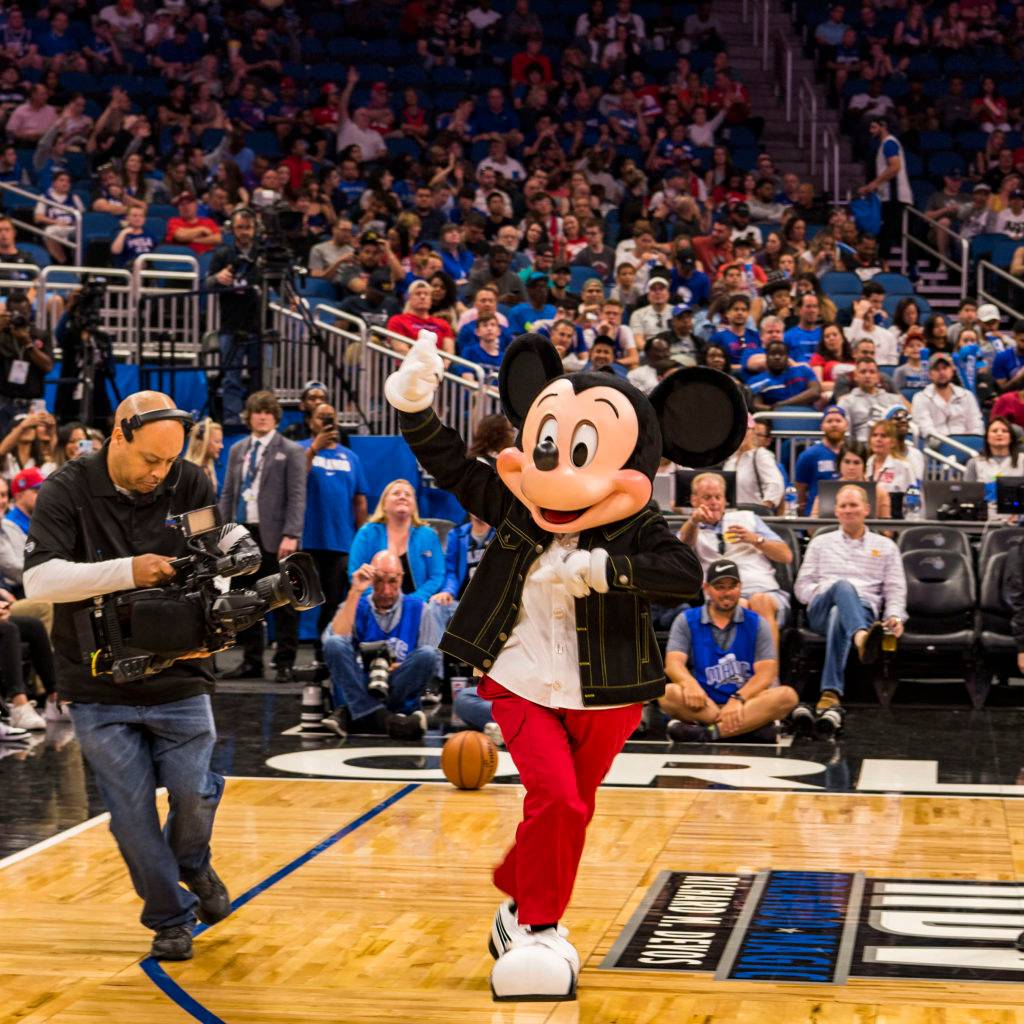 Mickey Mouse appears on court to announce the opening of The NBA Experience