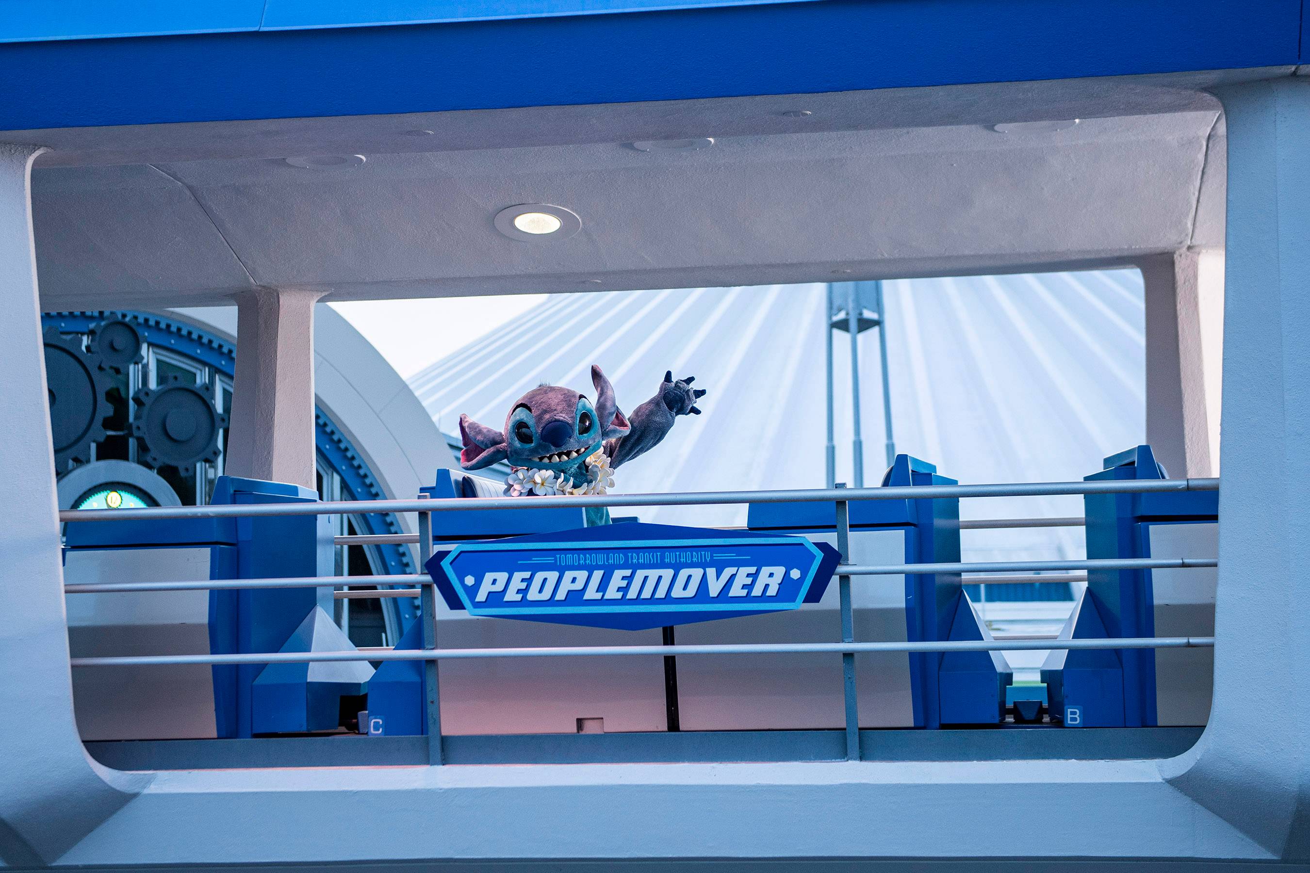 Stitch rides the Tommorowland Transit Authority PeopleMover