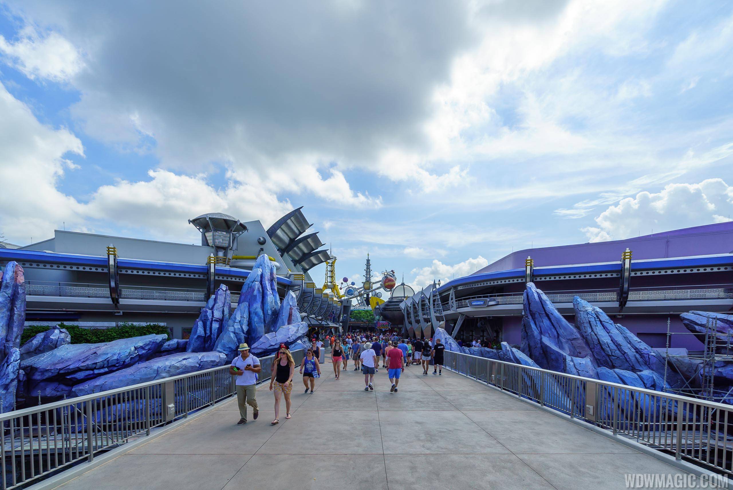 PHOTOS - Both sides of Tomorrowland entrance rock-work updated with new color