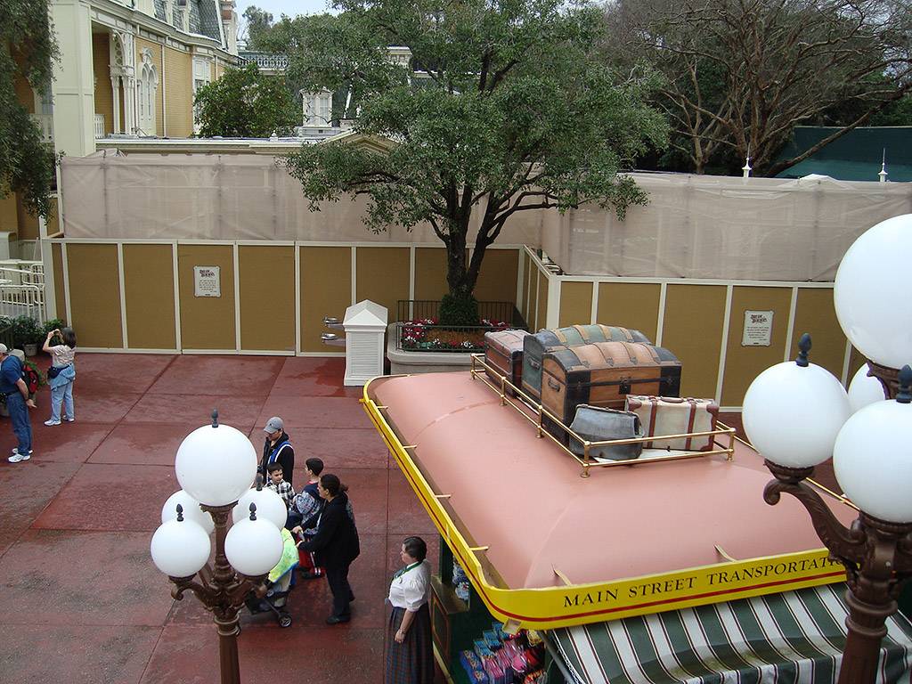 Construction walls appear outside the Town Square Exposition Hall - part of the meet and greet relocation project?