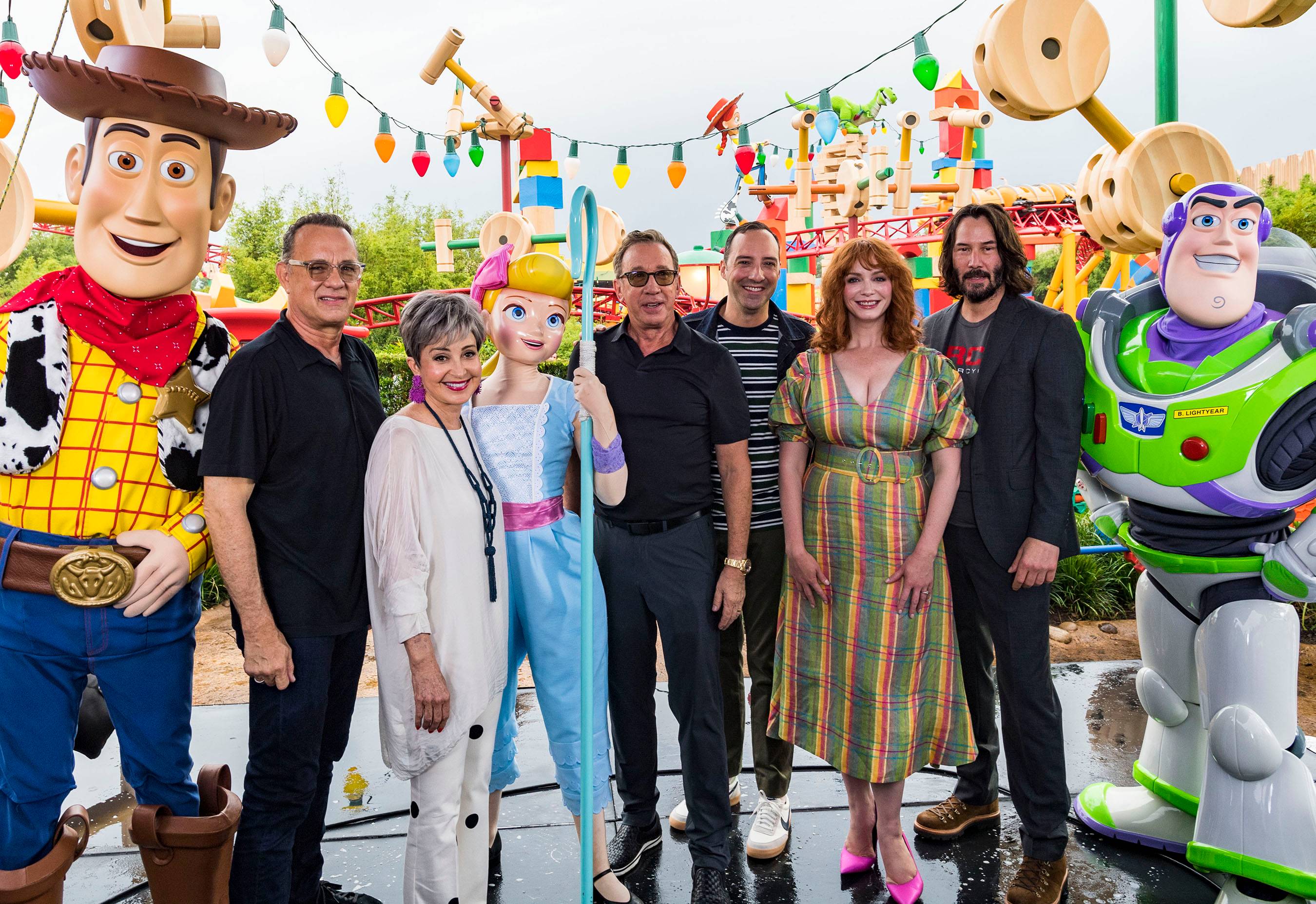 Stars from Disney•Pixar’s “Toy Story 4” appear with characters from the film inside Toy Story Land at Disney’s Hollywood Studios at Walt Disney World Resort in Lake Buena Vista, Fla., June 8, 2019. From left: Woody, Tom Hanks, Annie Potts, Bo Peep, Tim Allen, Tony Hale, Christina Hendricks, Keanu Reeves and Buzz Lightyear. (Matt Stroshane, photographer)