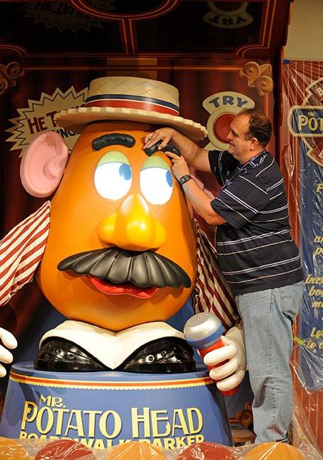 Photos of Imagineering programming the Mr Potato Head animatronic figure