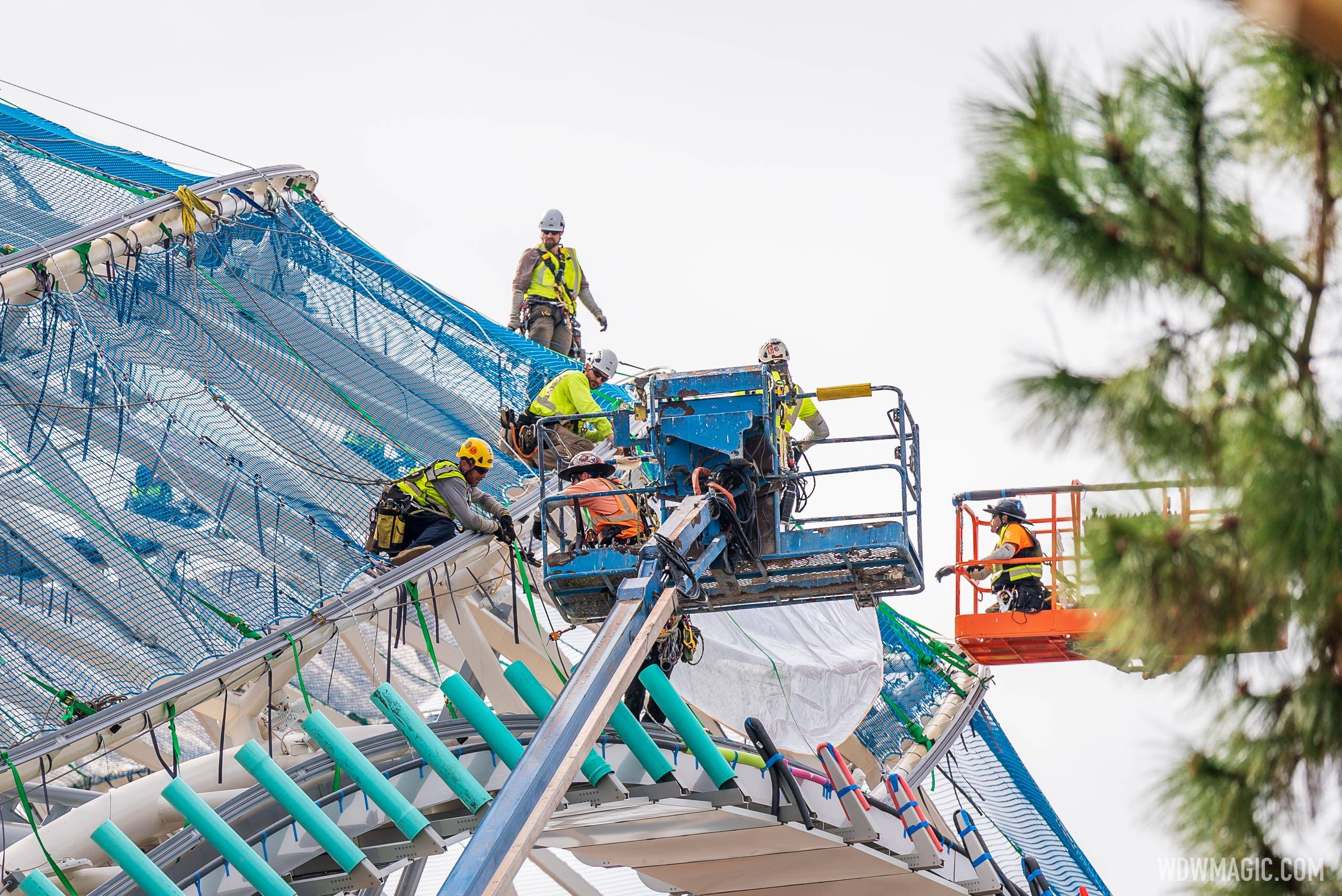 Crews installing the largest and highest section of canopy at TRON Lightcycle Run in Magic Kingdom