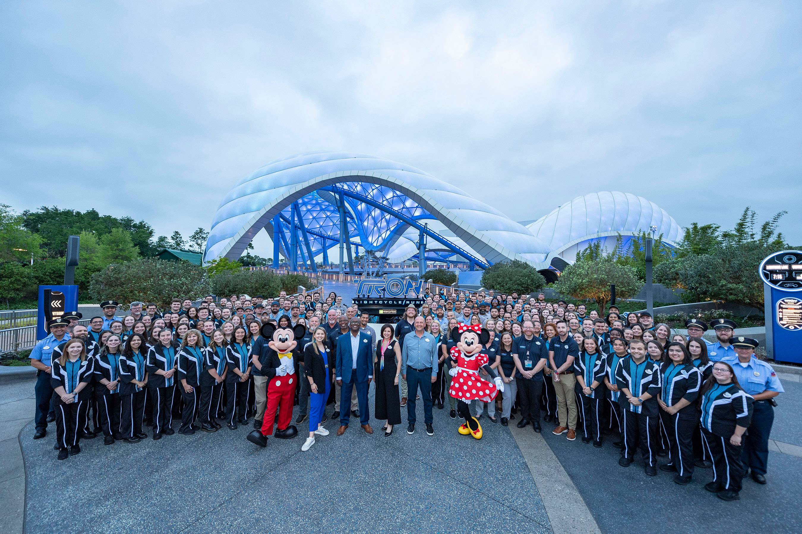 Disney Cast Members celebrate the grand opening of TRON Lightcycle Run with ribbon cutting moment at Magic Kingdom